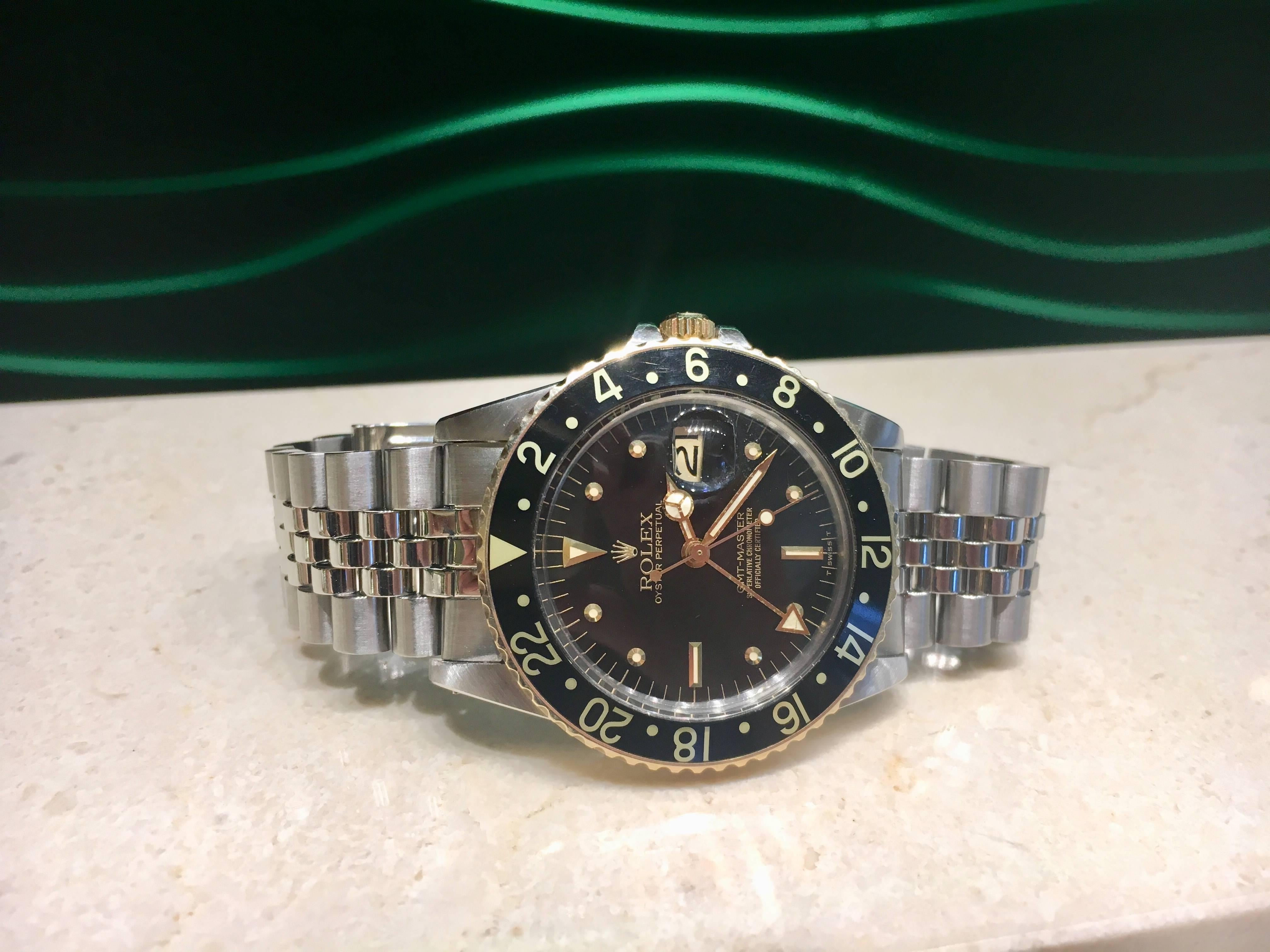 One Estate Rolex GMT timepiece, black dial, 40 mm with date, Model # 16753, Serial # 63376_ _ , 24 links including end pieces, circa 1980. Comes with Rolex box as pictured. 