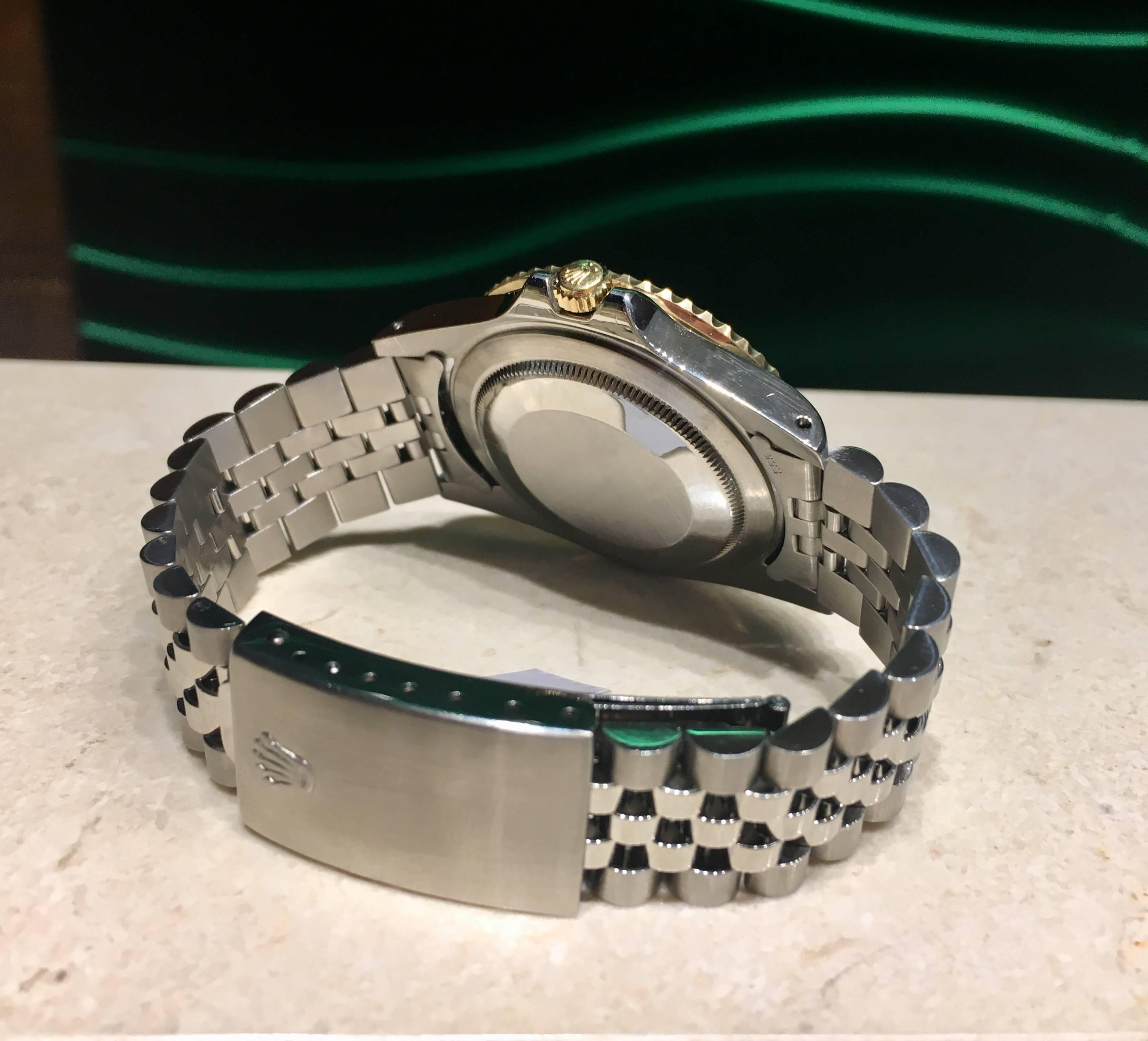 Women's or Men's Rolex Stainless Steel GMT Black dial Date Wristwatch Ref 16753, circa 1980