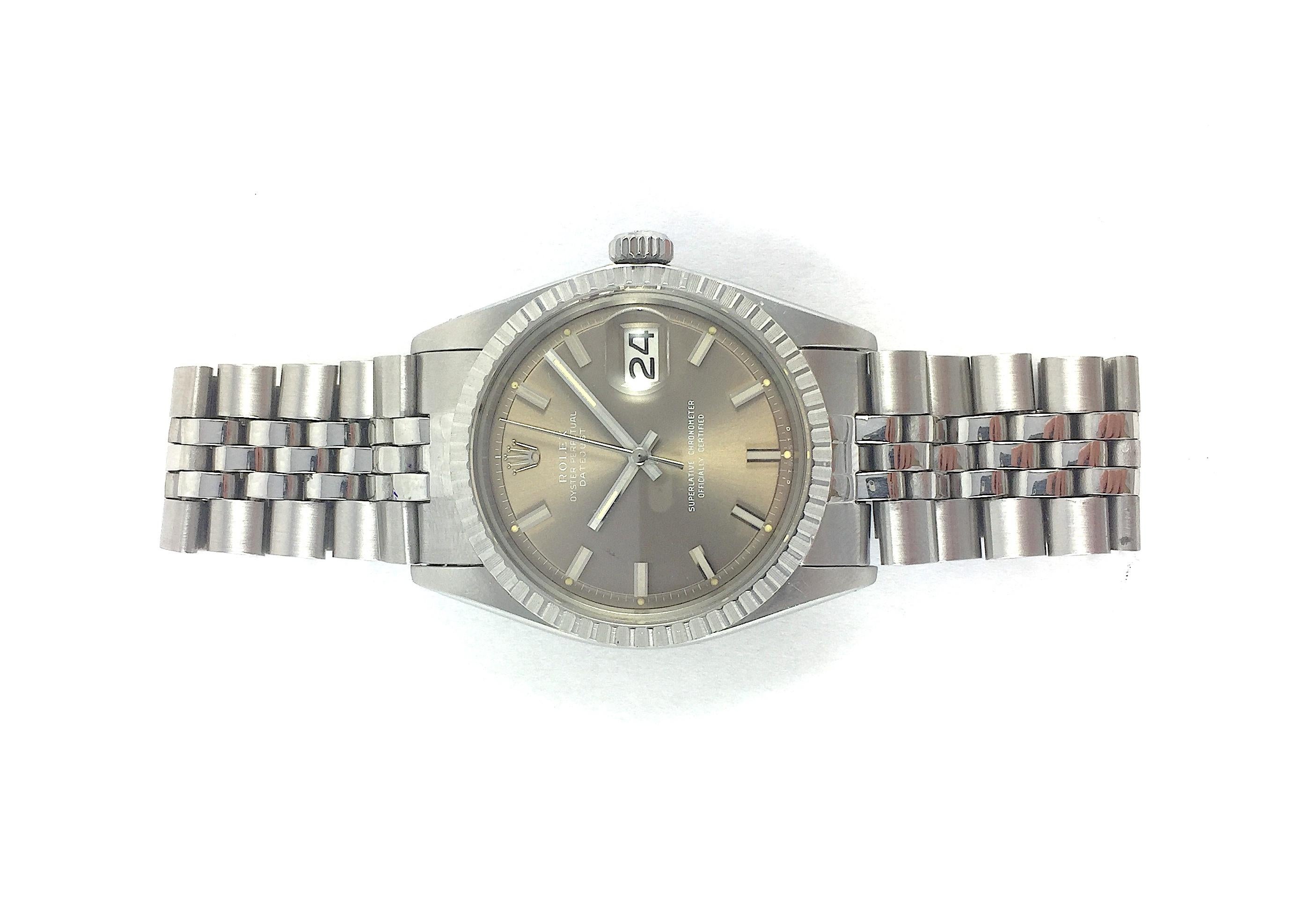 Rolex Stainless Steel and White Gold Oyster Perpetual Datejust Watch
Factory Rare Grey Wide-Boy Dial with Matching Wide-Boy Hands
Stainless Steel Engine-Turned Bezel
Stainless Steel Case
36mm in size 
Features Rolex Automatic Movement with Calibre