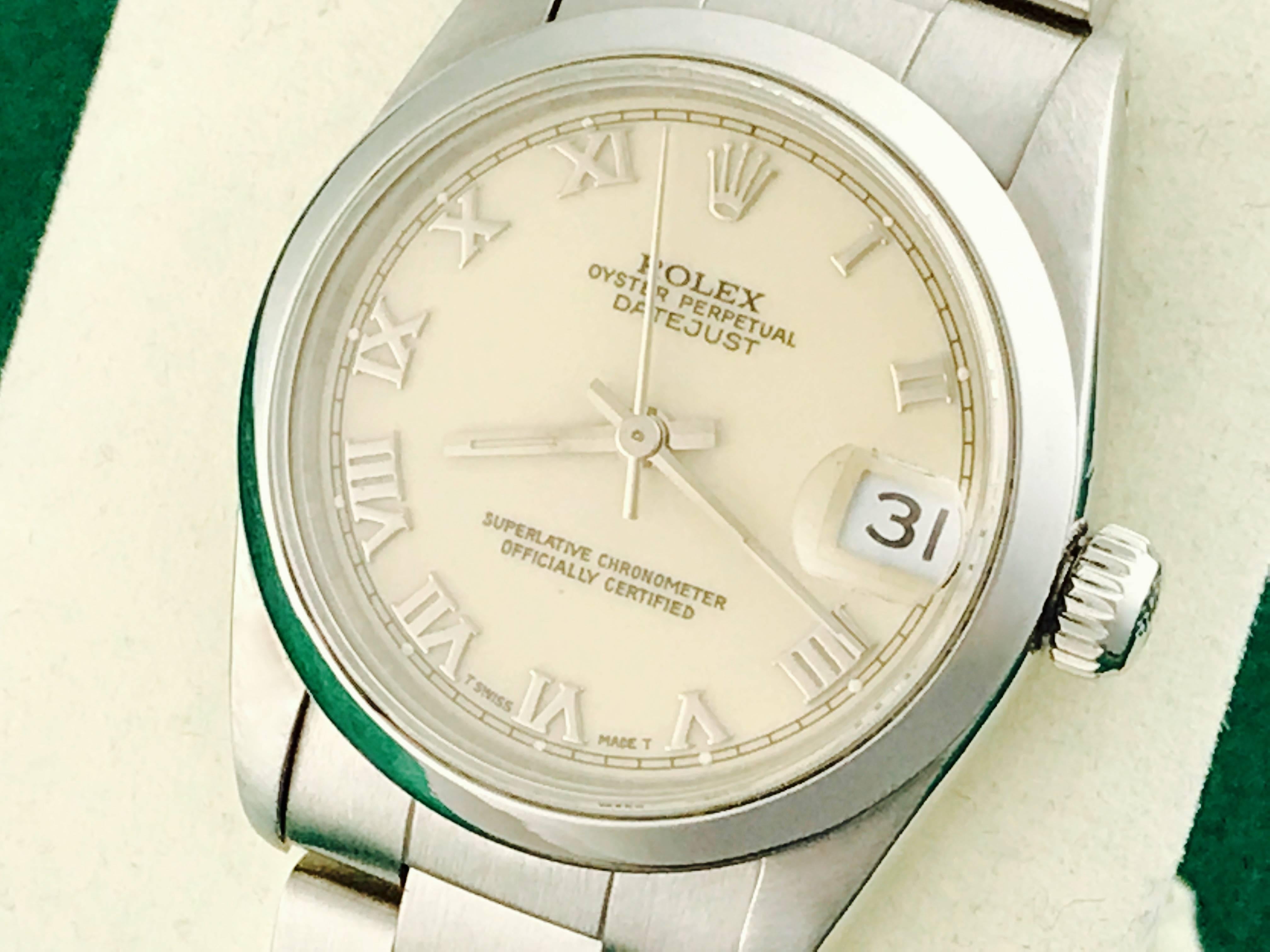 Rolex Datejust Model 68240 Stainless Steel Automatic Midsize Wrist Watch. Certified pre-owned and ready to ship.  Stainless Steel case with smooth bezel, 30mm diameter.  Stainless Steel oyster bracelet. Ivory dial with polished Roman numerals.  Box,