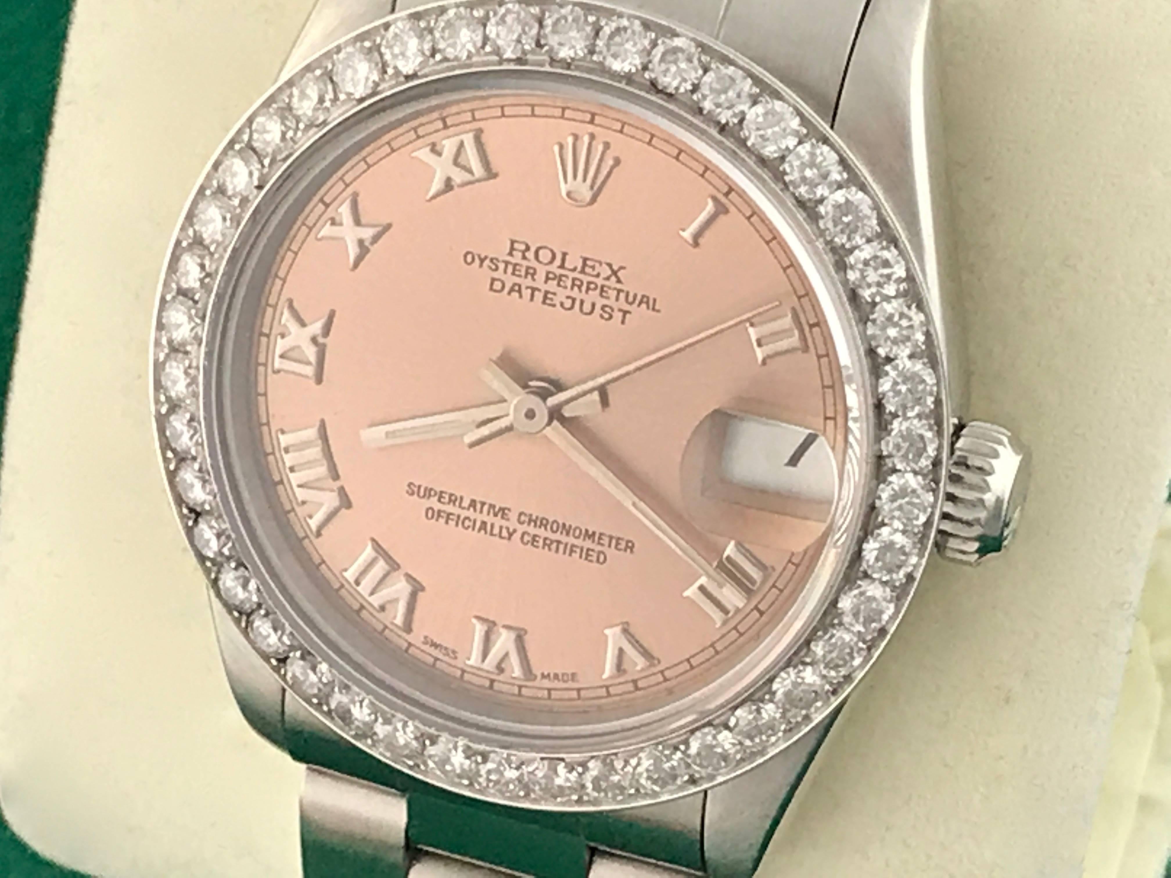 Rolex Datejust Midsize Model 68240 Stainless Steel Automatic Wrist Watch with rose dial and polished Roman numerals. Stainless steel case with custom 18k white gold diamond bezel. 30mm. Certified pre-owned and ready to ship.  Stainless Steel oyster