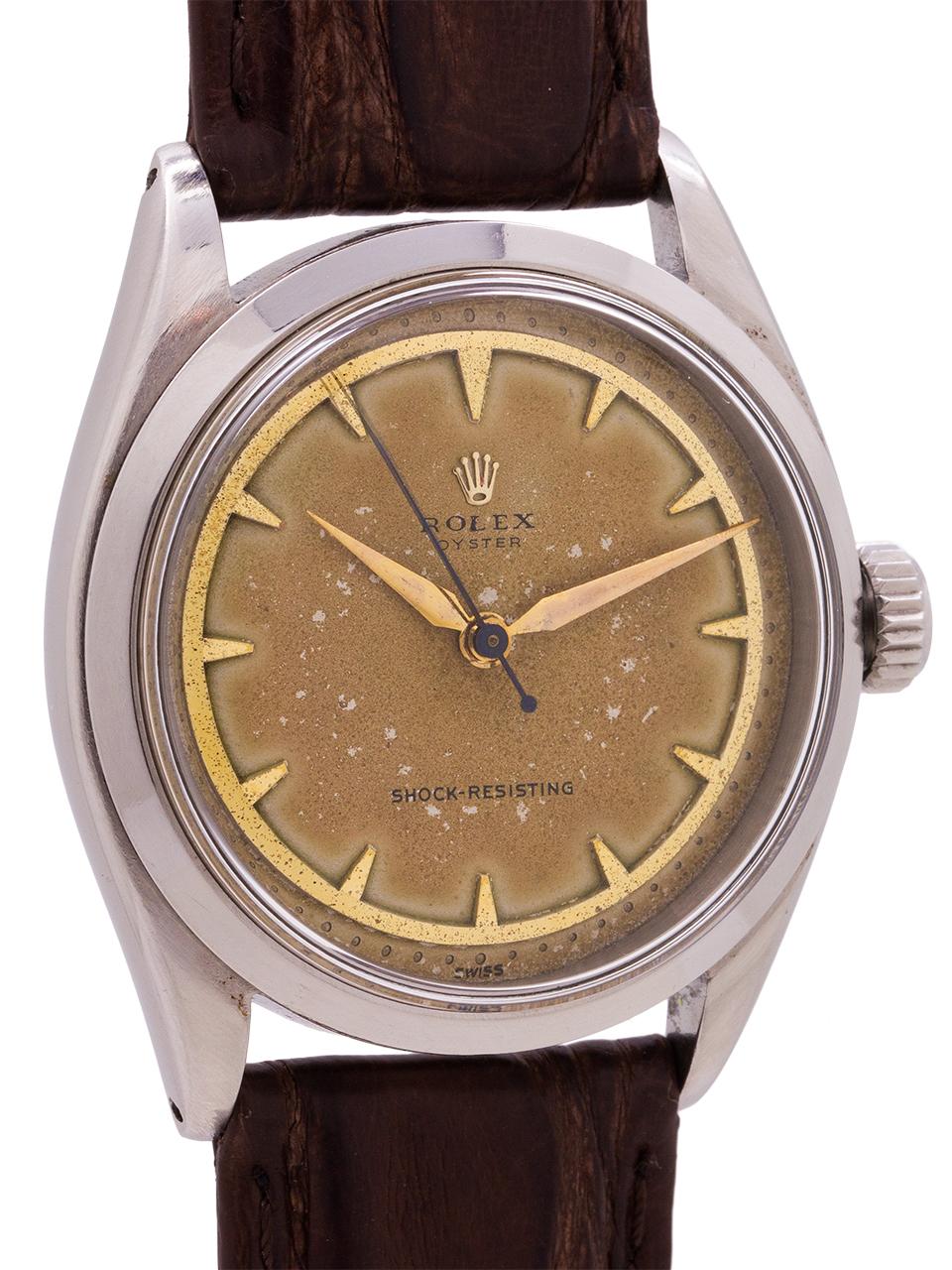   
Rolex Oyster reference# 6480, serial# 94,xxx circa 1955. Featuring a 34mm diameter case with smooth bezel and acrylic crystal. Unbelievably rare dial configuration, with heavy patina. On this Oyster the pointed hour markers all sit inside one