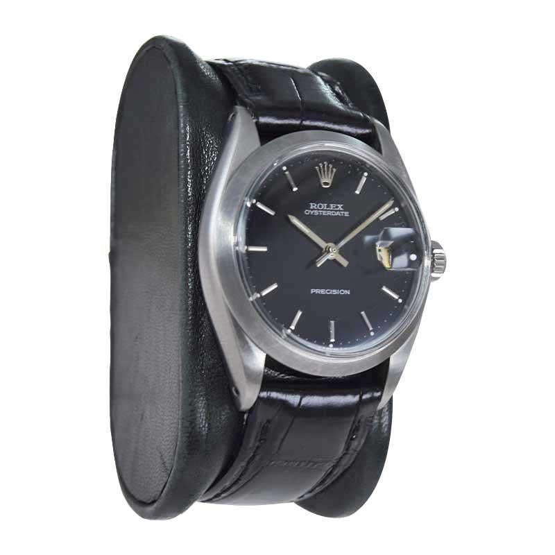 Moderniste Rolex Montre Oyster Date en acier inoxydable avec cadran noir d'origine, années 1960