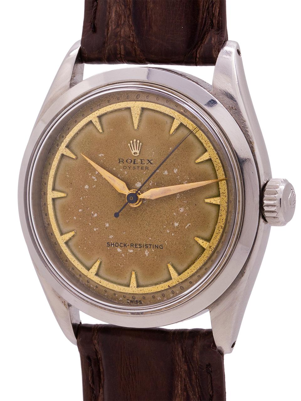 Rolex Oyster reference# 6480, serial# 94,xxx circa 1955. Featuring a 34mm diameter case with smooth bezel and acrylic crystal. Unbelievably rare dial configuration, with heavy patina. On this Oyster the pointed hour markers all sit inside one