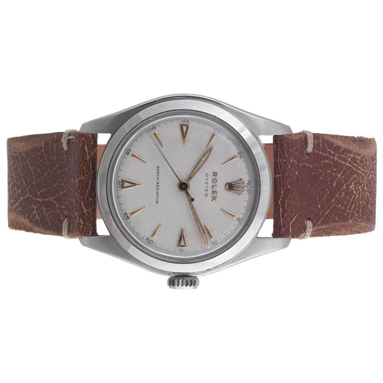 BERNARDO ANTICHITÀ PONTE VECCHIO FLORENCE
With manual wind movement silvered dial gold coloured baton numerals, Rolex oyster crown on brown leather strap, circa 1952, case diameter 34mm, Ref 6082 Case n 812361