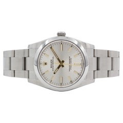 Rolex Oyster Perpetual de acero inoxidable de 34 mm con esfera plateada de bastones 124200