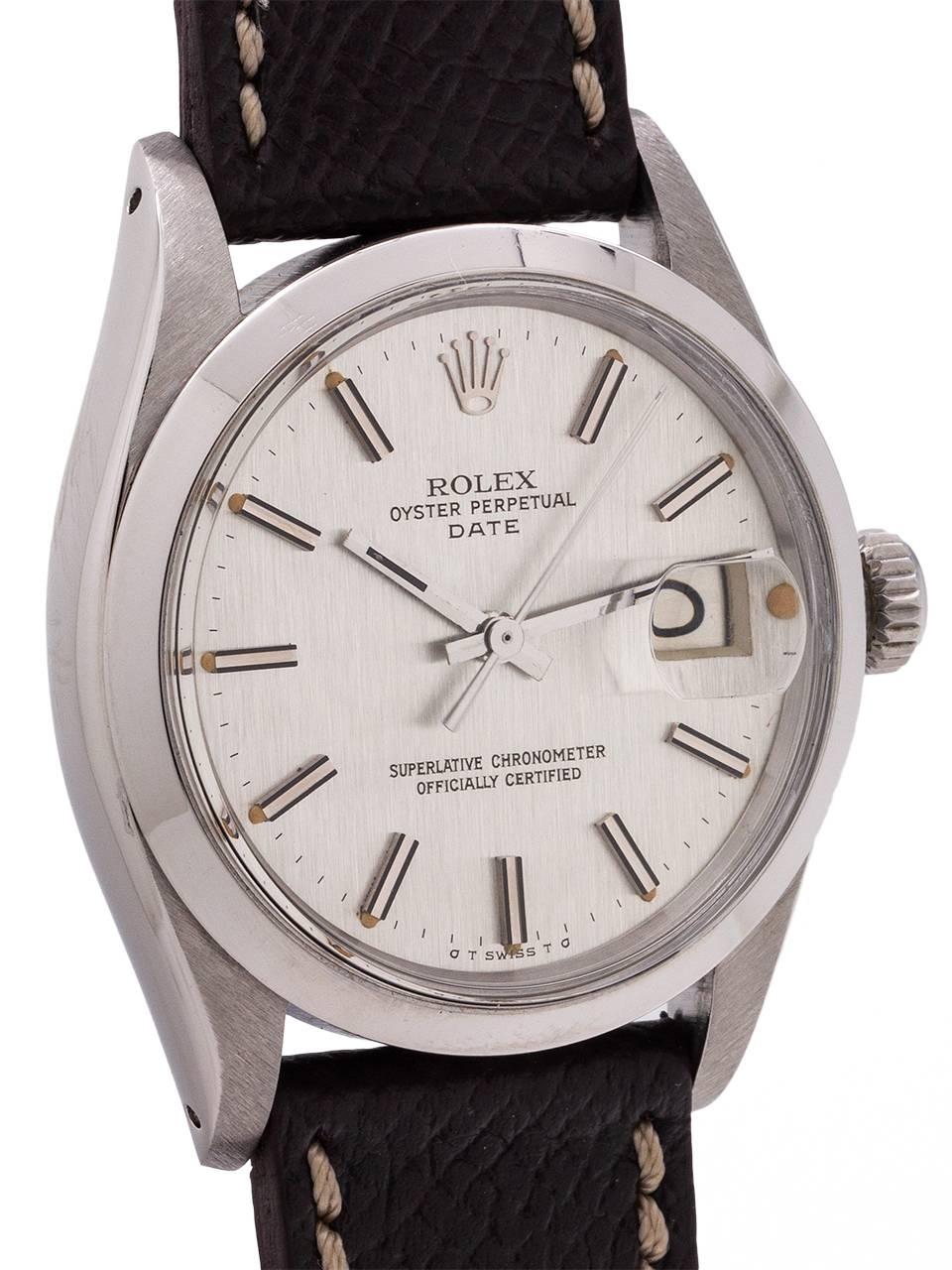 
Rolex Oyster Perpetual Date ref 1500 circa 1970. Featuring 34mm diameter case with smooth bezel, acrylic crystal, and original anthracite gray “linen” texture dial with applied silver indexes, warmly patina’d luminous indexes, and silver baton