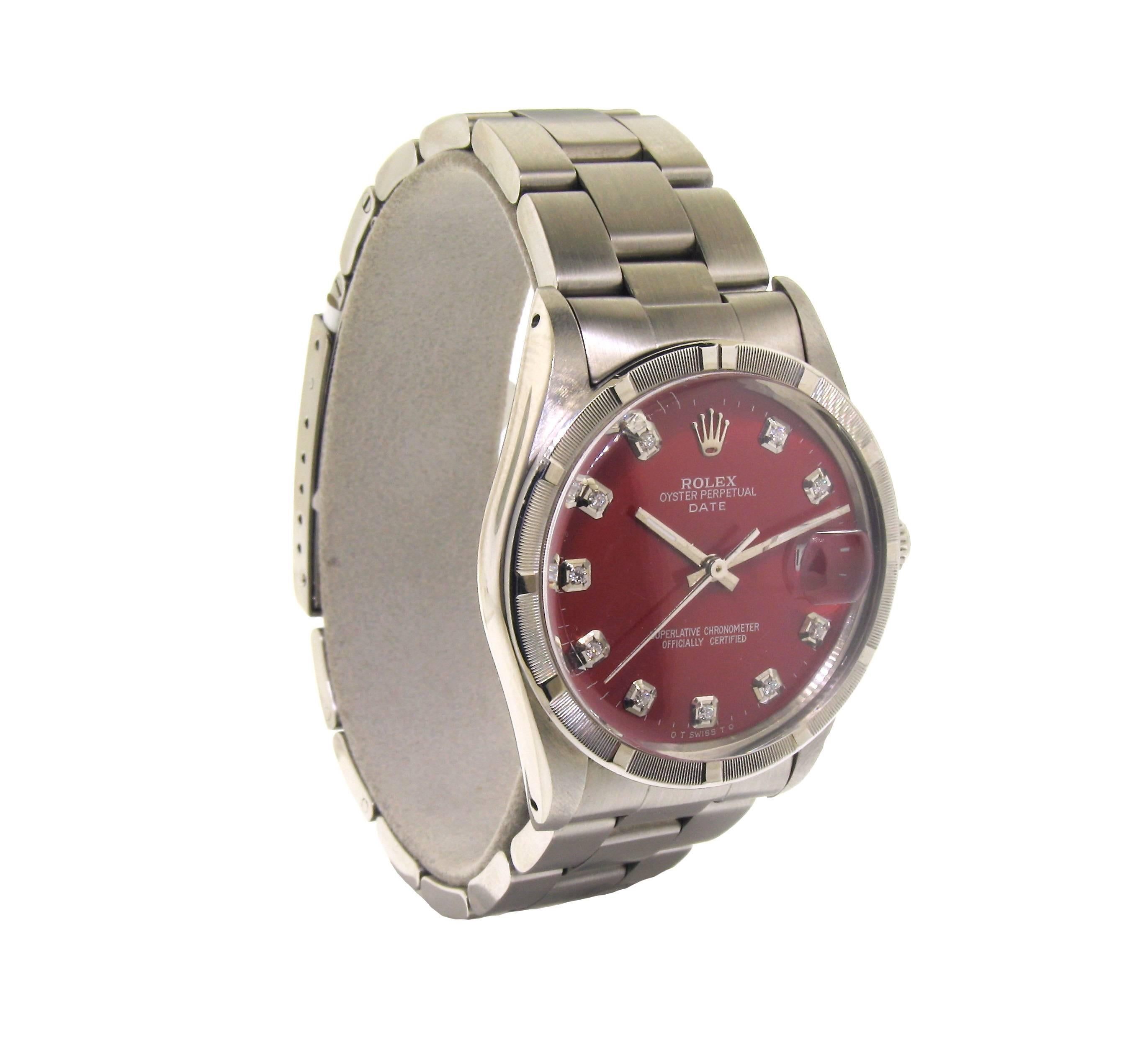 FACTORY / HOUSE: Rolex Watch Company
STYLE / REFERENCE: Oyster Perpetual Date / Reference 5500
METAL: Stainless Steel 
CIRCA: 1970's
MOVEMENT / CALIBER: Perpetual Winding / 27 Jewels 
DIAL / HANDS: Custom Red Dial with Diamond Markers / Silver Baton