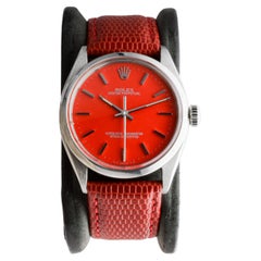 Rolex Edelstahl Oyster Perpetual mit rotem Zifferblatt circa 1960er Jahre