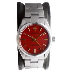 Rolex Oyster Perpetual de acero inoxidable con esfera roja personalizada circa años 70