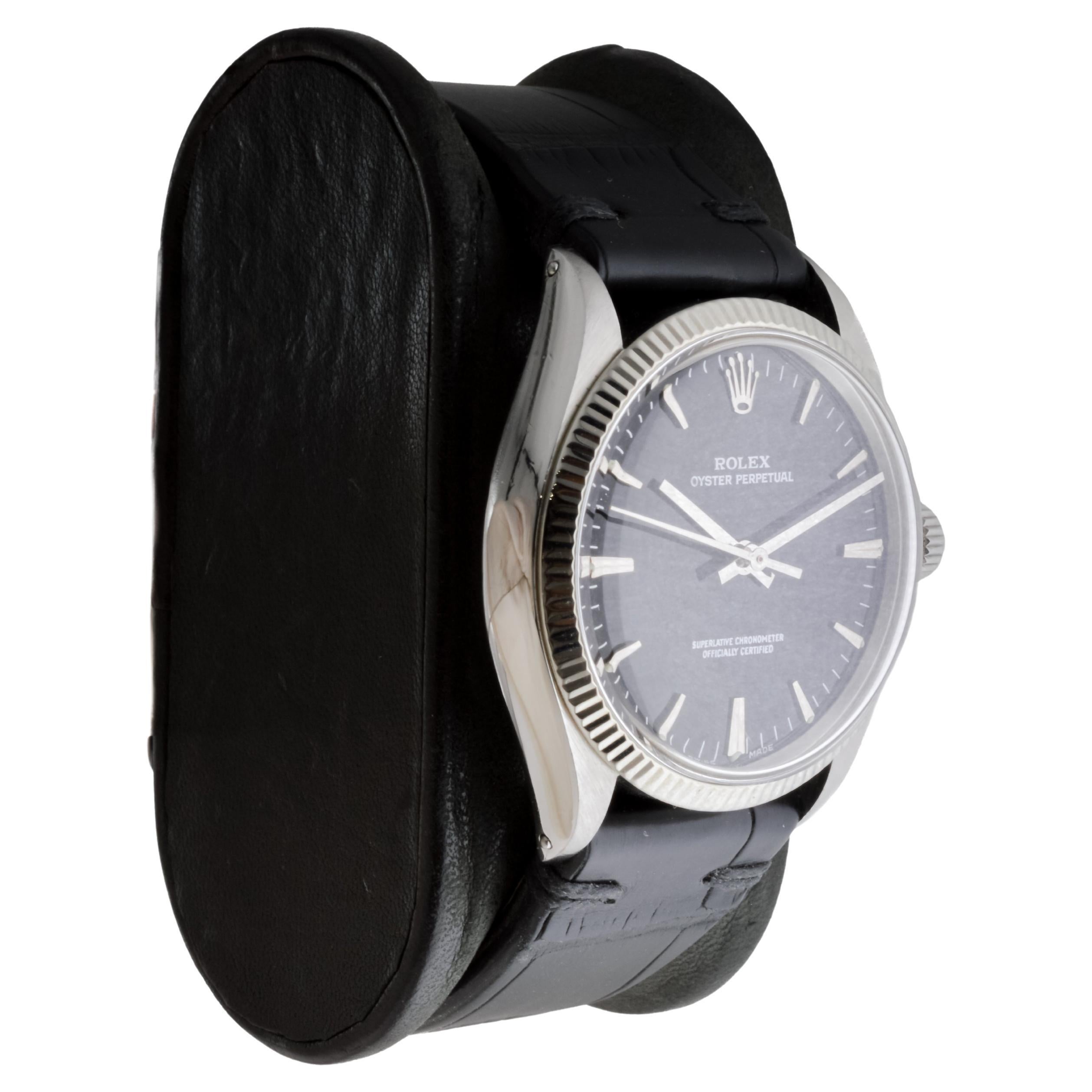 FACTORY / HOUSE: Rolex Watch Company
STYLE / REFERENCE: Oyster Perpetual / Reference 1005
METAL / MATERIAL: Stainless Steel / Solid White Gold Bezel
CIRCA / YEAR: 1972
DIMENSIONS / SIZE: Length 39mm X Diameter 34mm
MOVEMENT / CALIBER: Perpetual