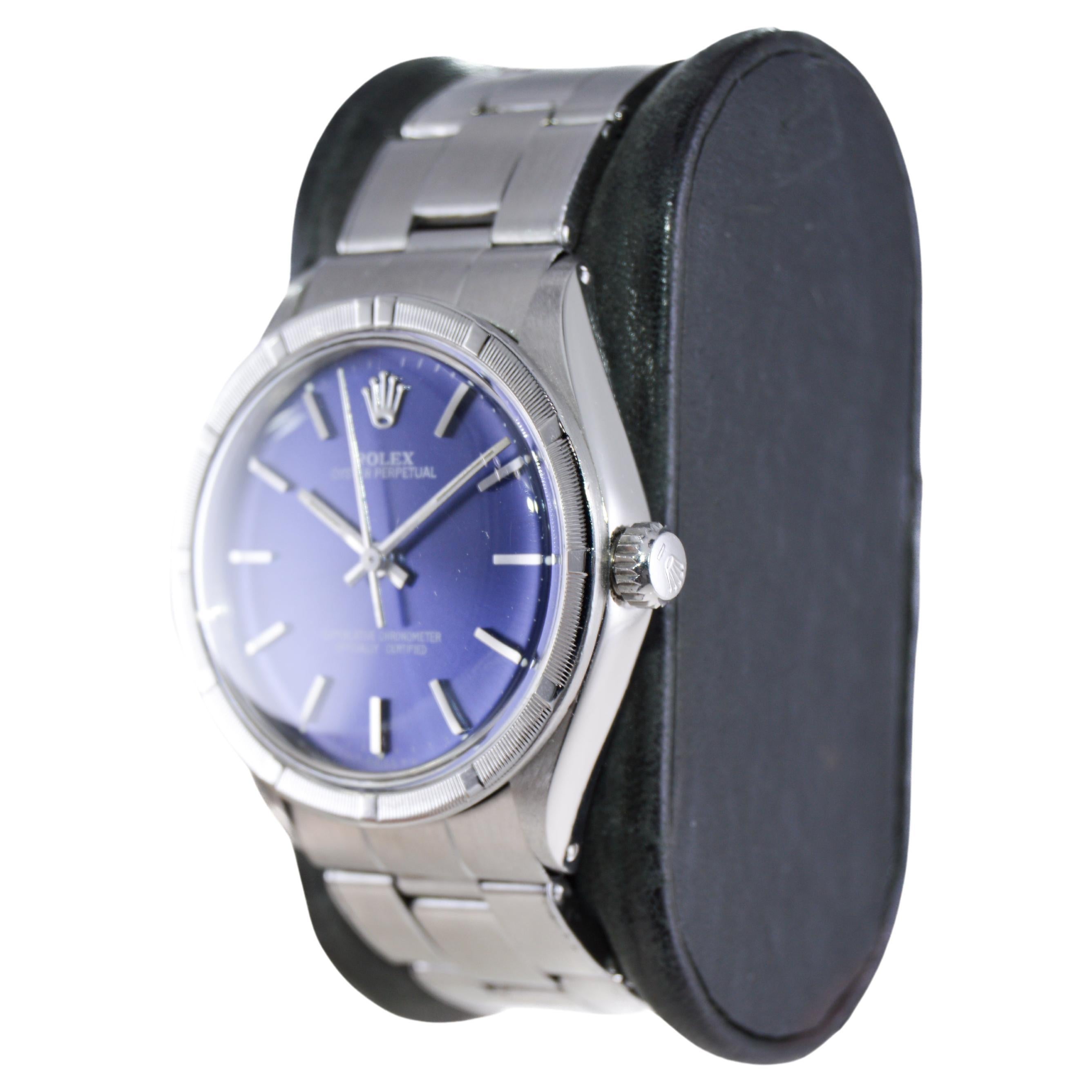 Modern Rolex Stainless Steel Oyster Perpetual With Rare Engine Turned Bezel 1970's For Sale