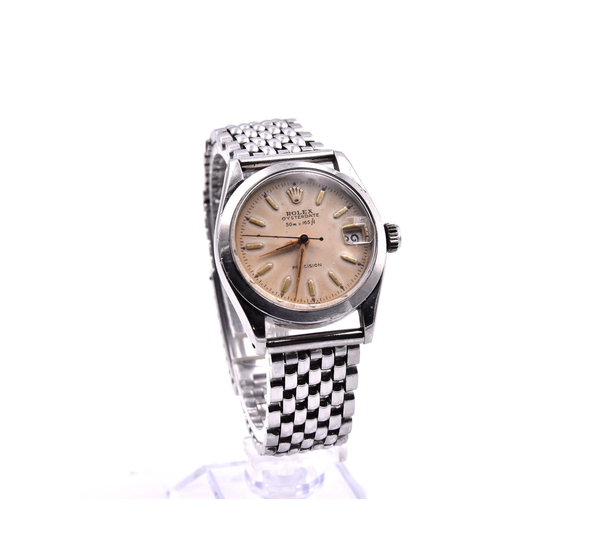 Movement: Manual Wind
Function: hours, minutes, seconds, date
Case: 31mm round stainless-steel case
Dial: Champagne Dial with yellow gold stick markers
Band: stainless steel factory rice grain bracelet
Serial #: 65XXX
Reference #: 6466

No Box or