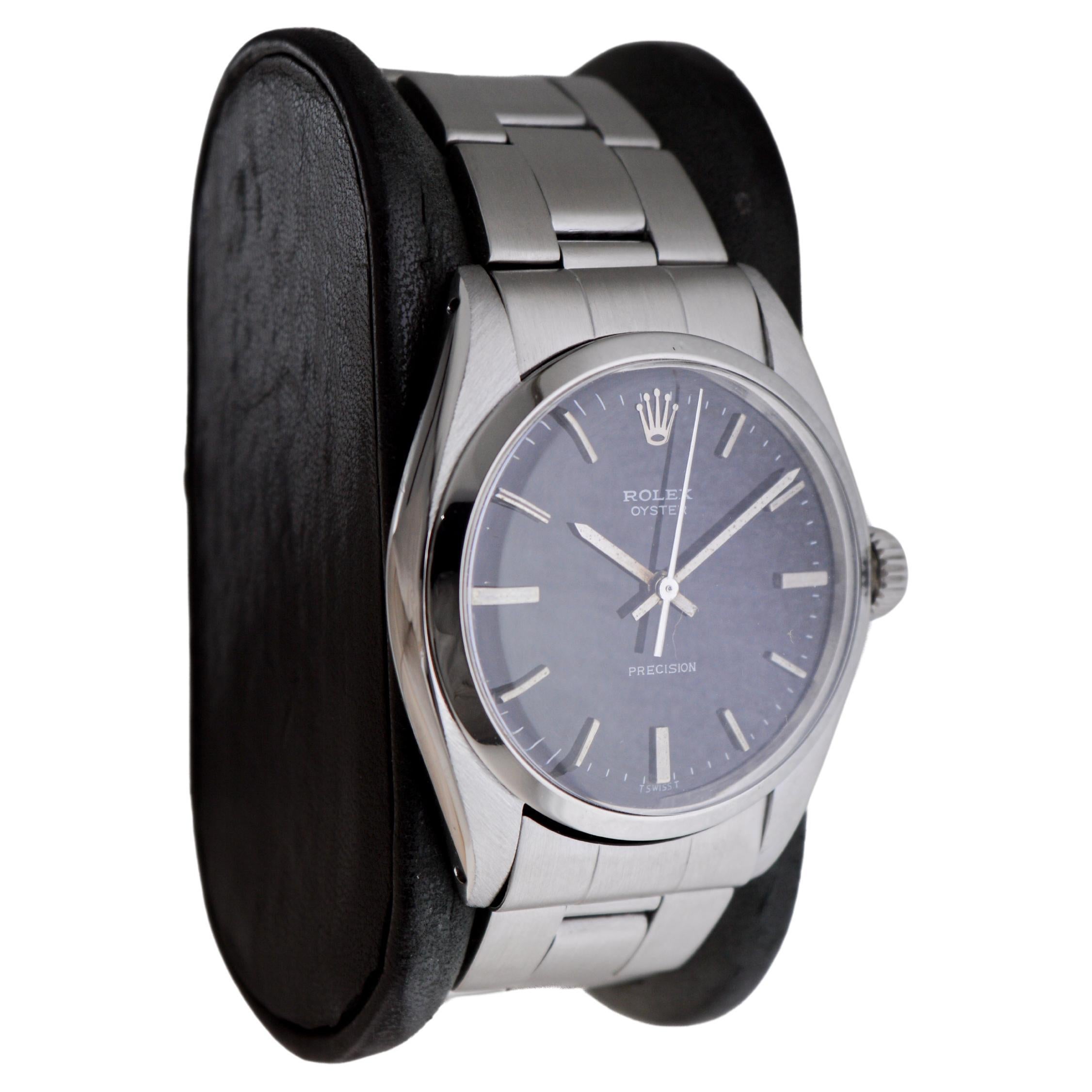 Modern Rolex Stainless Steel Oyster with Rare Black Dial And Original Bracelet For Sale
