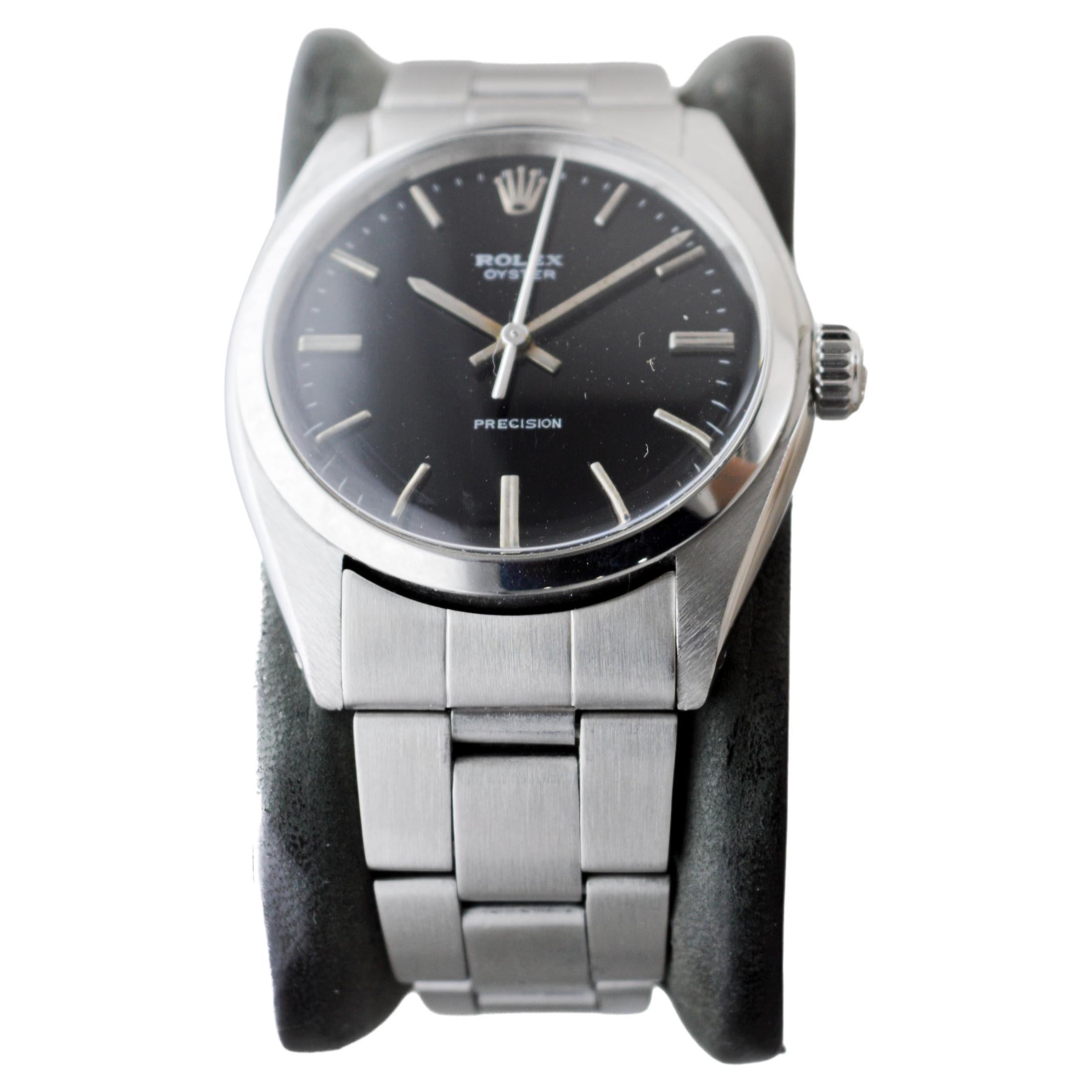 Women's or Men's Rolex Stainless Steel Oyster with Rare Black Dial And Original Bracelet