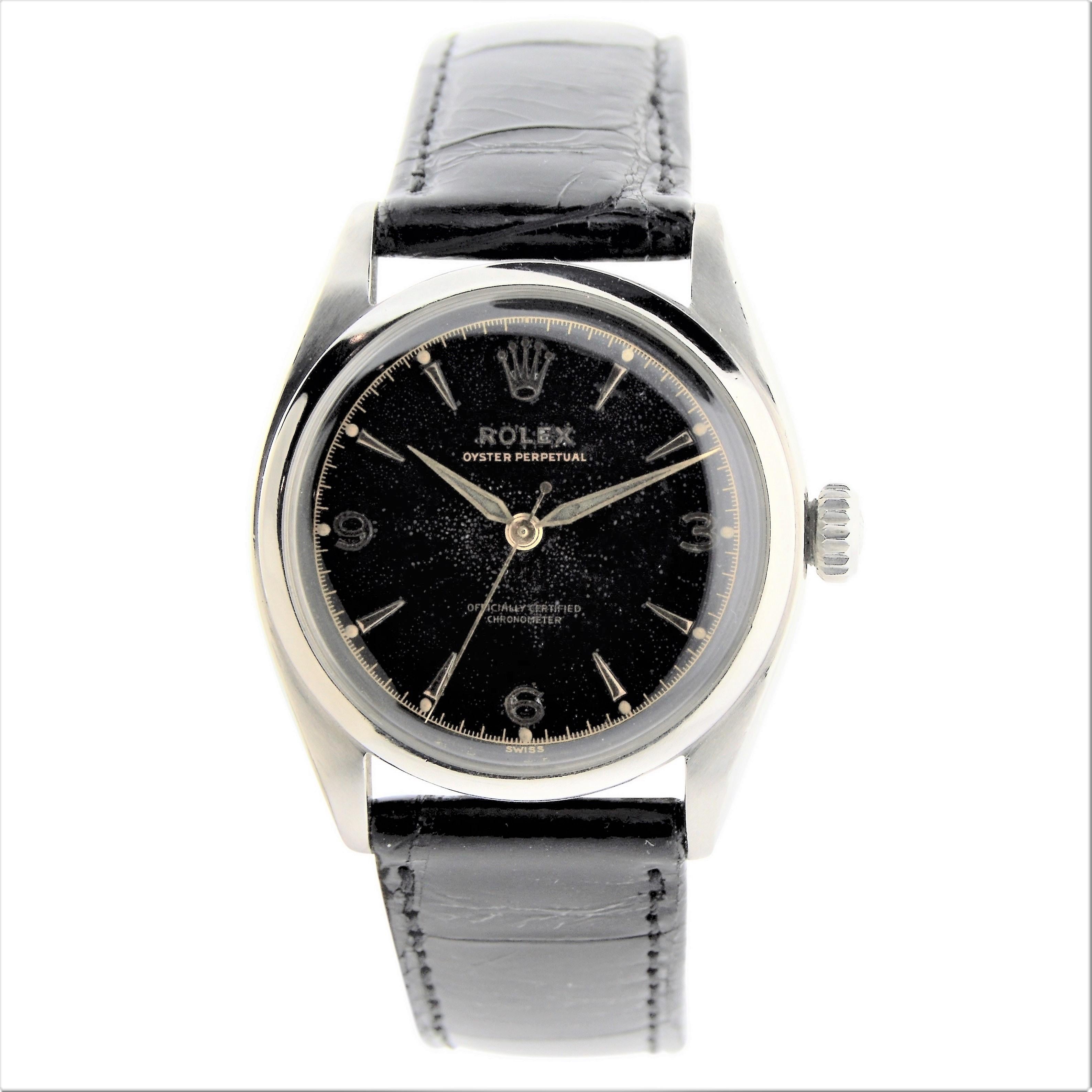FACTORY / HOUSE: Rolex Watch Company
STYLE / REFERENCE: Oyster Perpetual / Ref. 6084
METAL / MATERIAL: Stainless Steel
DIMENSIONS: 39mm X 33mm
CIRCA: 1953 / 54
MOVEMENT / CALIBER: Perpetual Winding / cal. 645 / 20 Jewels
DIAL / HANDS: Black Dial
