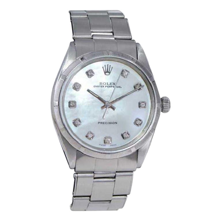 FACTORY / HOUSE: Rolex Watch Company
STYLE / REFERENCE: Oyster perpetual / Reference 1002
METAL / MATERIAL: Stainless Steel
CIRCA / YEAR: 1960's
DIMENSIONS / SIZE: Length 39mm x Diameter 34mm
MOVEMENT / CALIBER: Perpetual Winding / 26 Jewels /