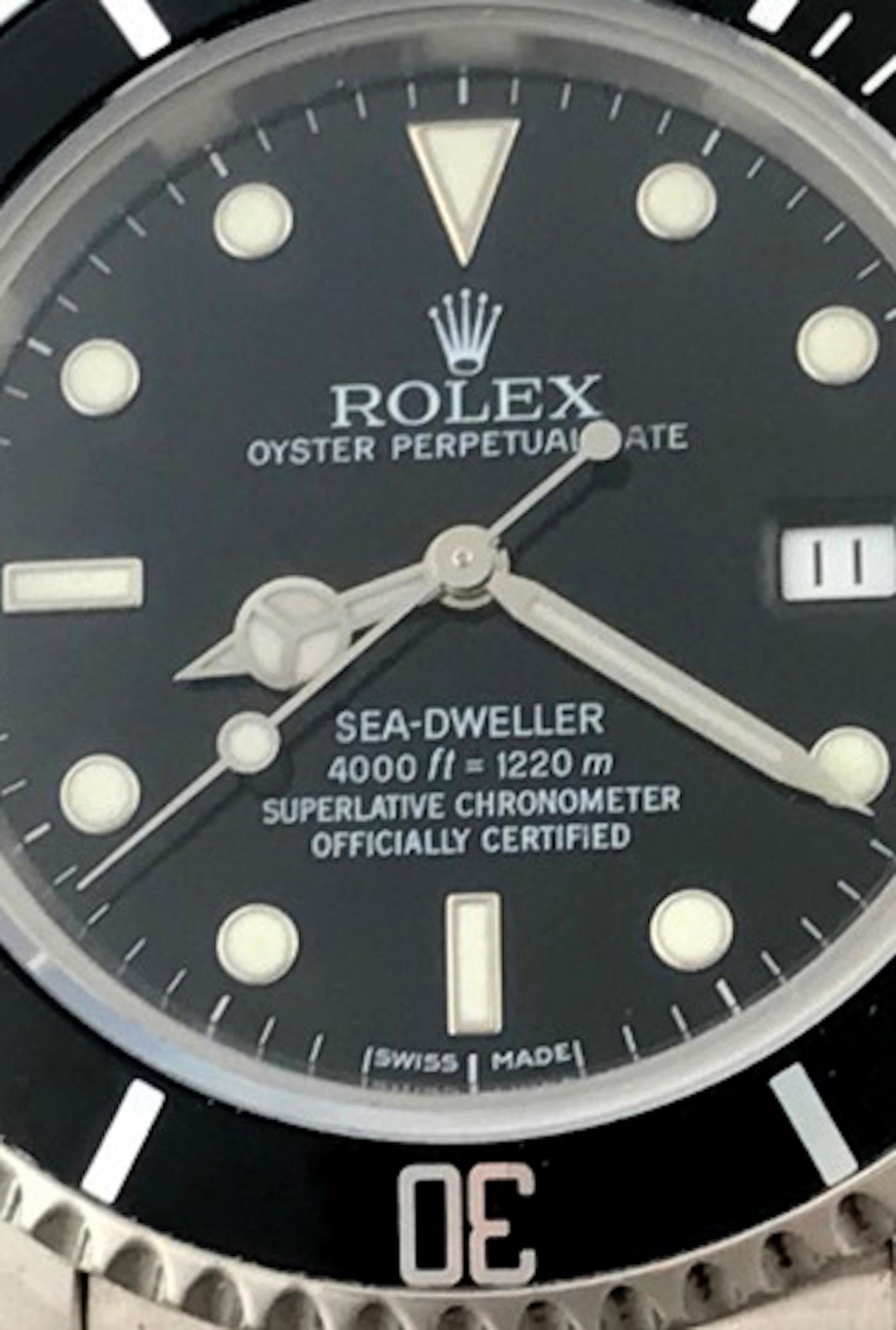 Like New Rolex Mens Sea-Dweller Model 16600 at a great price.  Automatic Winding Oyster Perpetual Date Movement.  Features a stainless steel case, diameter 40mm. Stainless Steel Oyster bracelet with flip-lock clasp. Black Dial with luminous hour