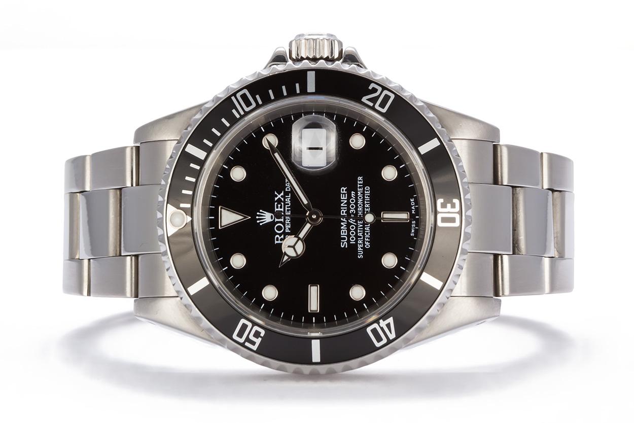 We are pleased to offer this 2001 Rolex Stainless Steel Submariner 16610. This classic and highly sought after Rolex sport watch features a 40mm stainless steel case, factory original black metal insert time-lapse bezel and factory original black
