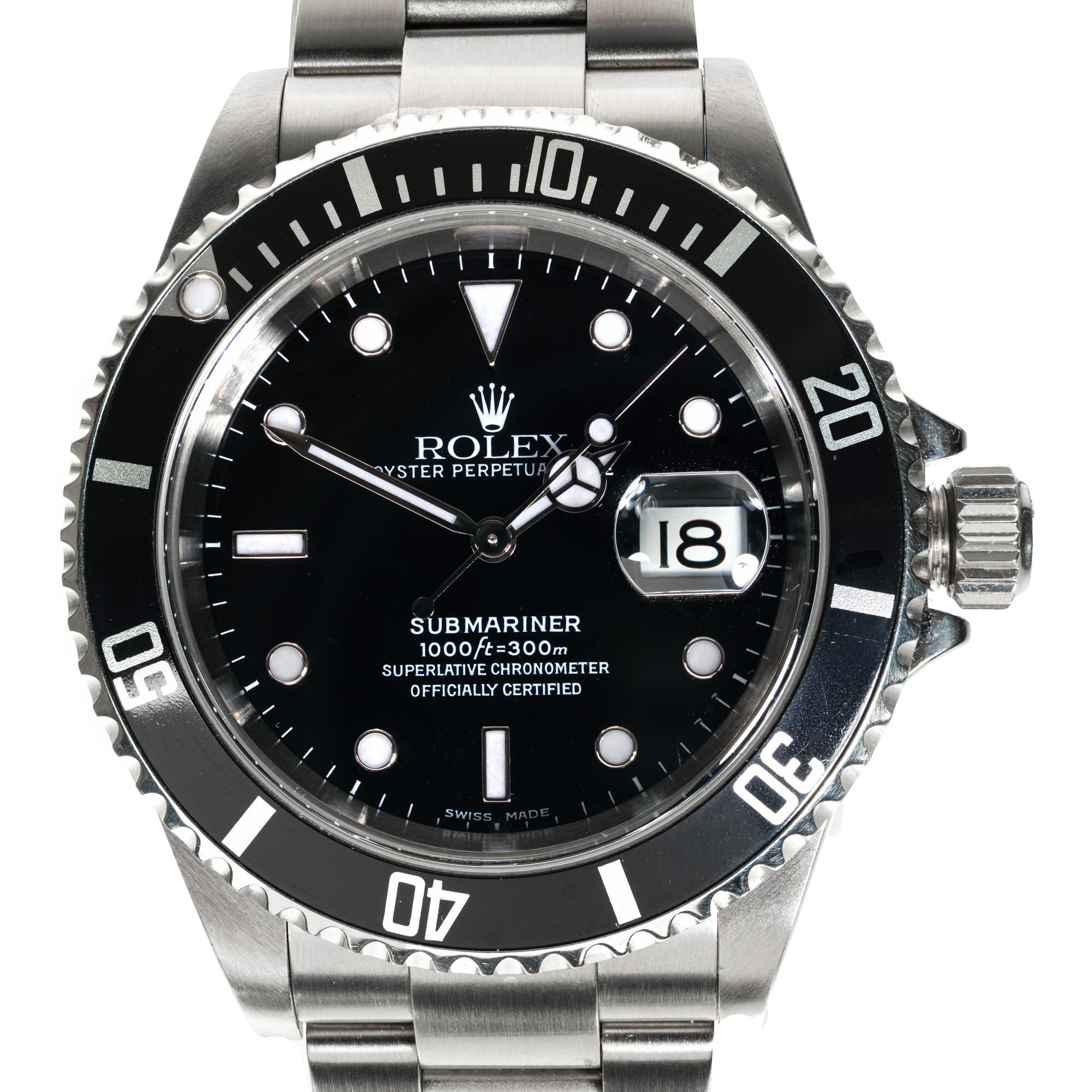 Men's stainless steel Rolex submariner circa 2002 with oyster band. All original. 40mmFully serviced. One year service warranty.

Length: 47.35mm
Width: 40mm
Band width at case: 20mm
Case thickness: 14mm
Band: Oyster stainess steel 
Crystal: