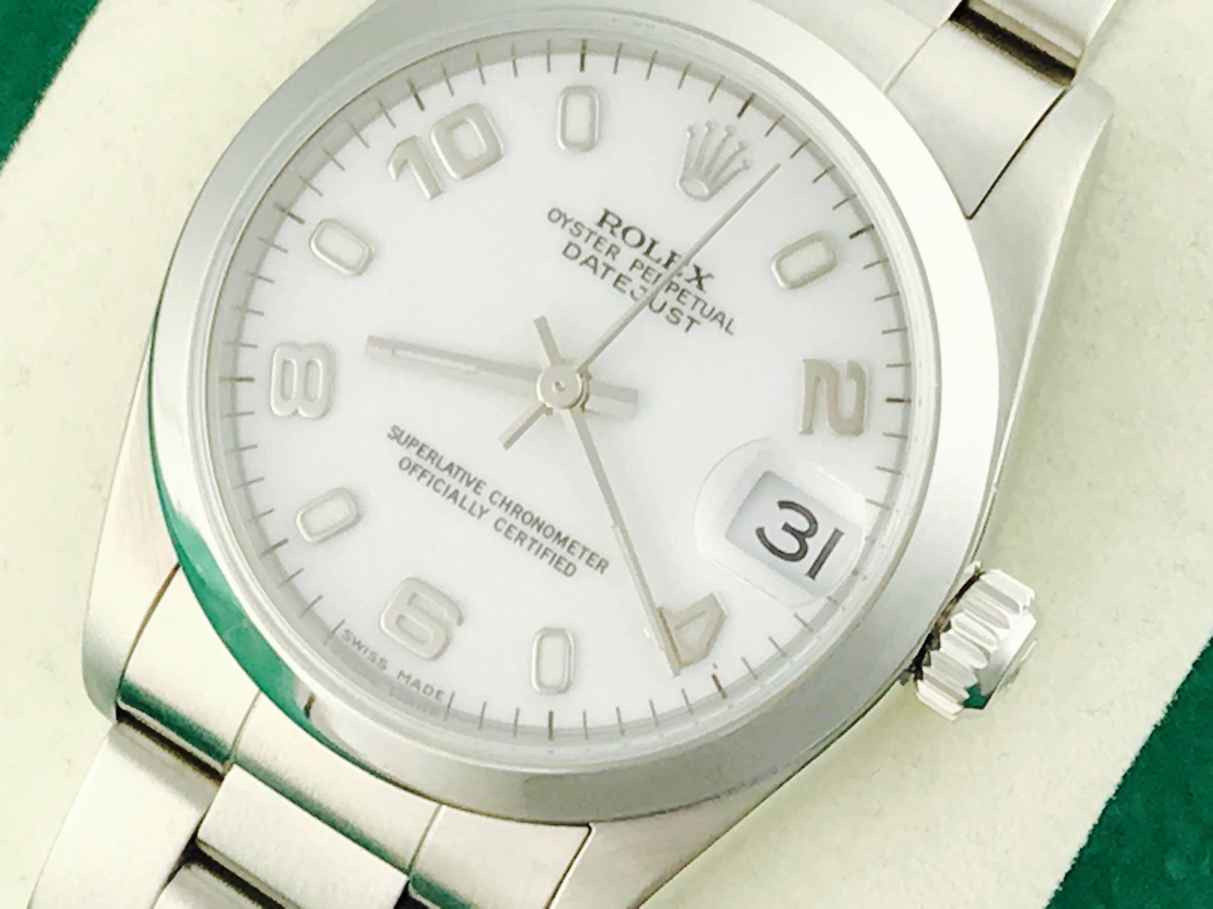 Rolex Datejust Model 68240 Stainless Steel Automatic Midsize Wristwatch. Certified pre-owned and ready to ship.  Stainless Steel case with smooth bezel, 30mm diameter.  Stainless Steel oyster bracelet. White dial with steel Arabic numerals.  Box,