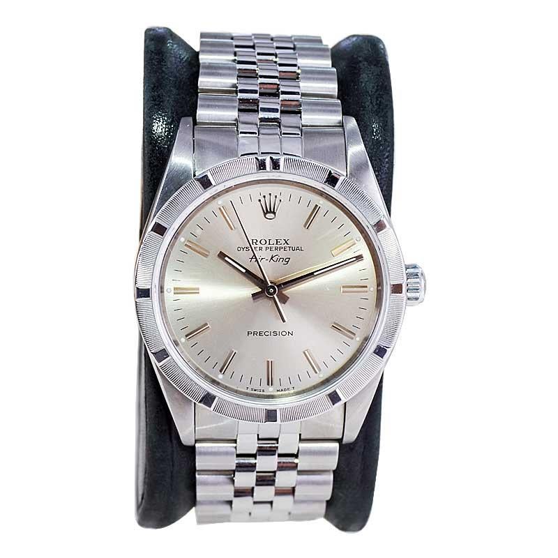 FACTORY / HOUSE: Rolex Watch Company
STYLE / REFERENCE: Oyster Perpetual Air King / Reference 14010
METAL / MATERIAL: Stainless Steel
CIRCA / YEAR: 1996
DIMENSIONS / SIZE: Length 43mm X Diameter 34mm
MOVEMENT / CALIBER: Perpetual Winding / 27 Jewels