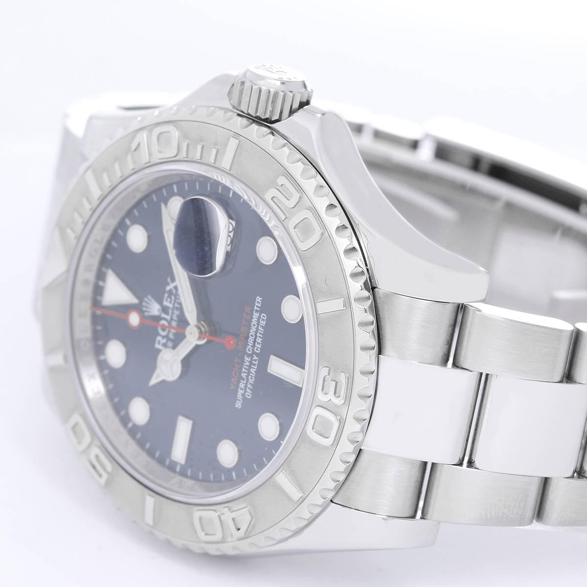 Rolex Yacht-Master Men's Stainless Steel Watch 116622 -  Automatic winding, 31 jewels, Quickset, sapphire crystal. Stainless steel case with platinum bezel  (40mm diameter). Blue dial with luminous markers. Stainless steel Oyster bracelet with