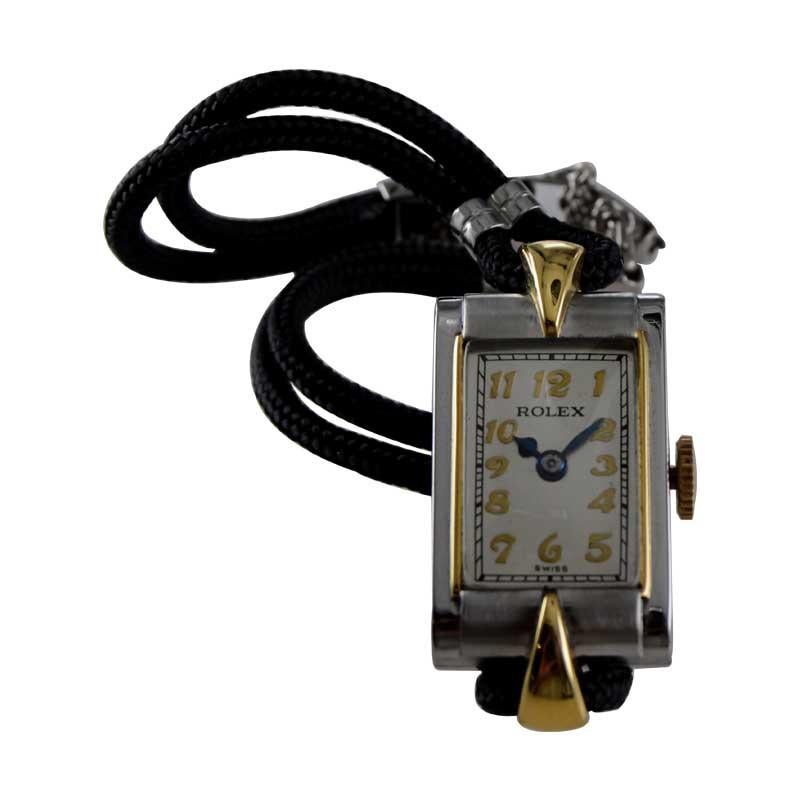 FACTORY / HOUSE: Rolex Watch Company
STYLE / REFERENCE: Art Deco / Reference 6311
METAL / MATERIAL: Steel & Gold
CIRCA / YEAR: 1920's
DIMENSIONS / SIZE: Length 33mm X Width 15mm
MOVEMENT / CALIBER: Manual Winding / 15 Jewels 
DIAL / HANDS: Silvered