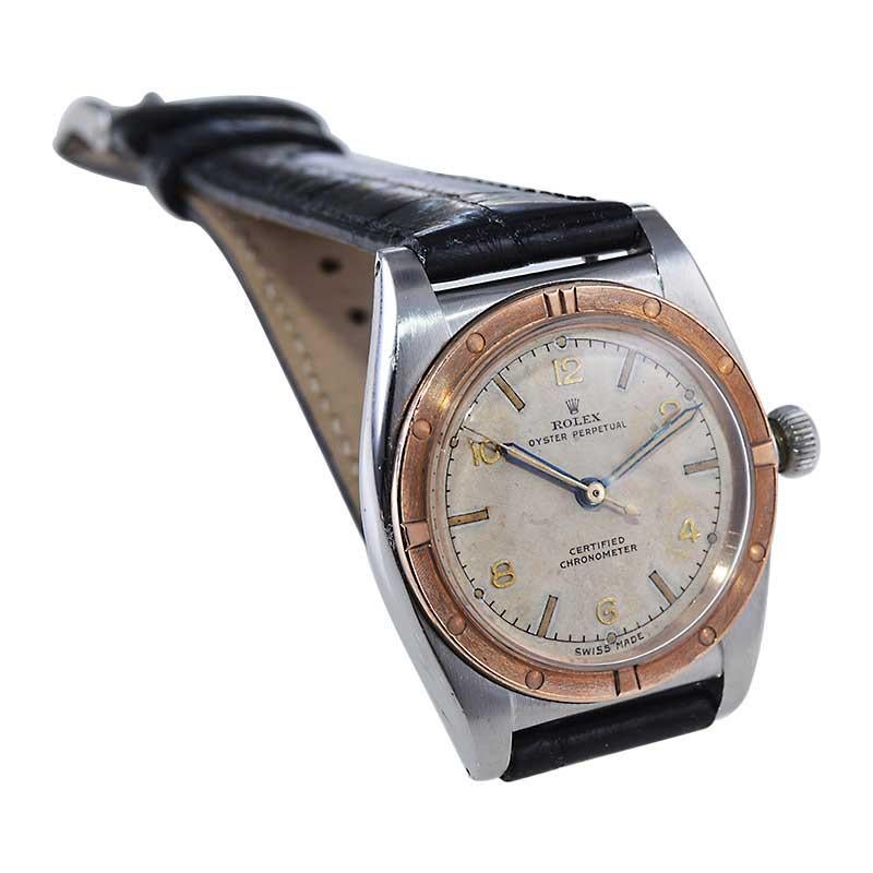 FACTORY / HOUSE: Rolex Watch Company
STYLE / REFERENCE: Bubble Back / Reference 2940
METAL / MATERIAL: Stainless Steel / 14Kt. Solid Pink Gold Bezel
CIRCA / YEAR: 1942
DIMENSIONS / SIZE: Length 32mm X Diameter 39mm
MOVEMENT / CALIBER: Perpetual