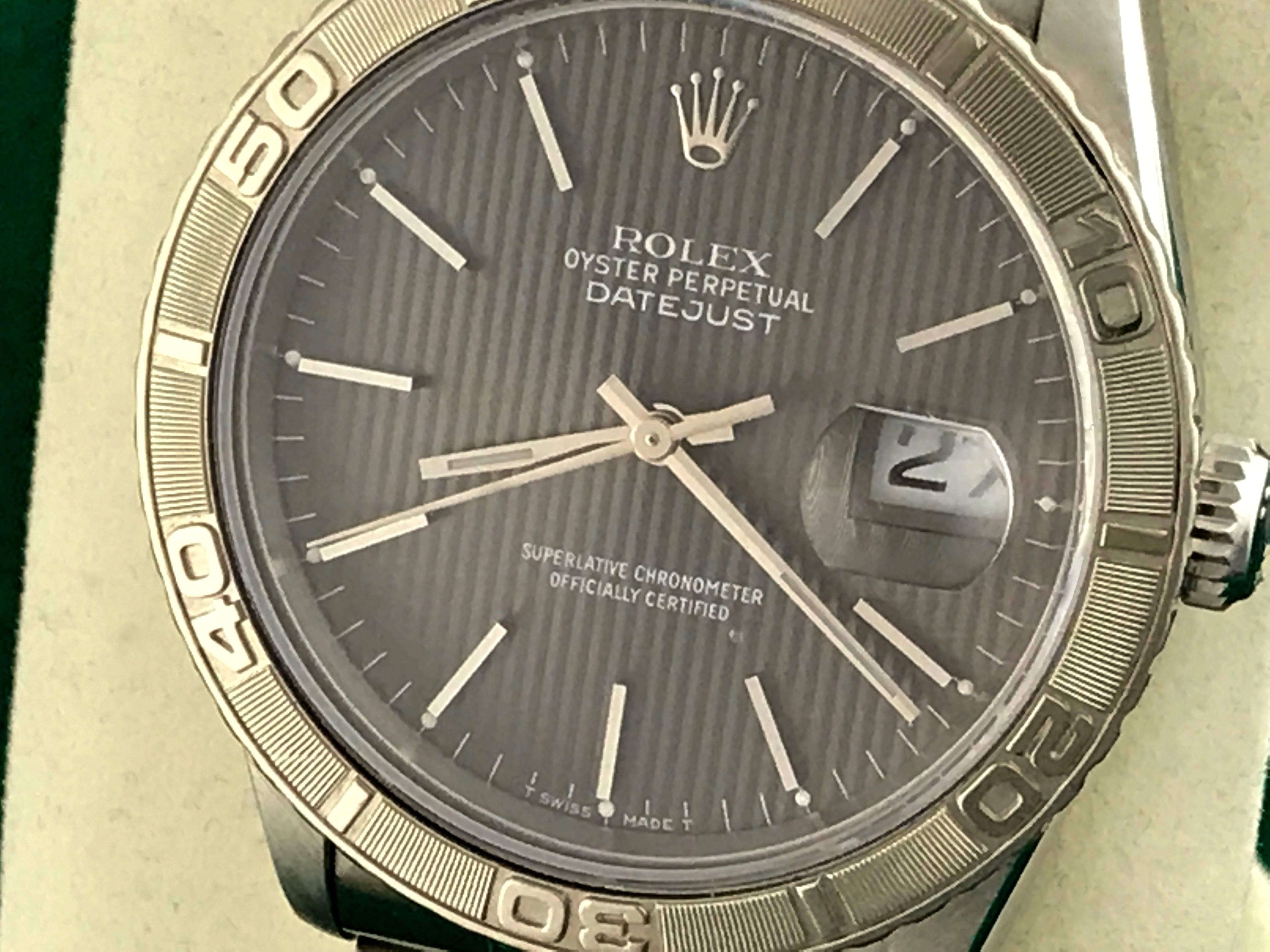 The Rolex Datejust Model 16264 stainless steel men's automatic wrist watch. Certified pre-owned and ready to ship.  Featuring a slate gray tapestry dial with polished hour markers and stainless steel case with 18k white gold Thunderbird bezel.