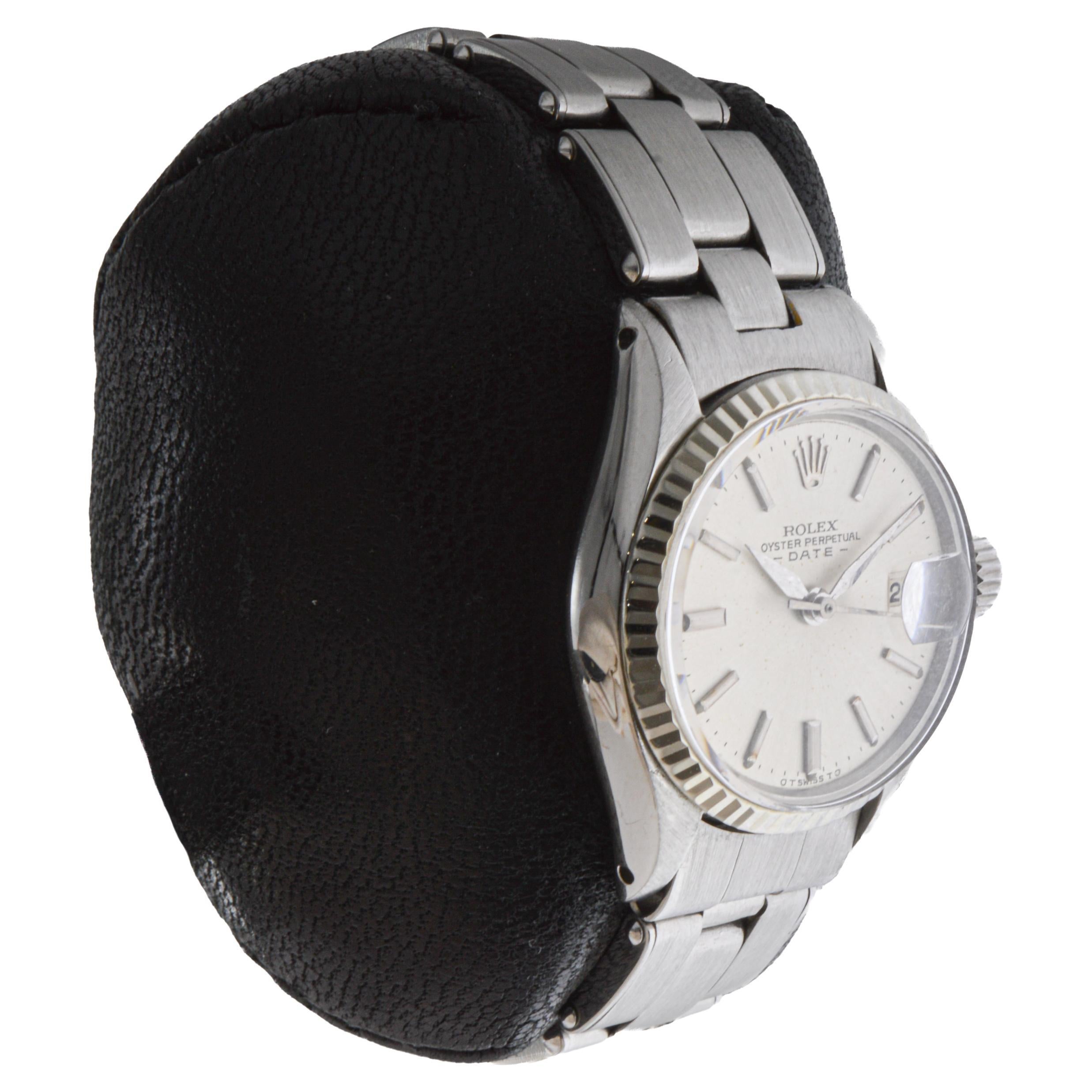 FACTORY / HOUSE: Rolex Watch Company
STYLE / REFERENCE: Oyster Perpetual Date / Reference 6517
METAL / MATERIAL: Stainless Steel
CIRCA / YEAR: 1960's
DIMENSIONS / SIZE: Length 32mm X Diameter 25mm
MOVEMENT / CALIBER: Perpetual Winding / 26 Jewels /