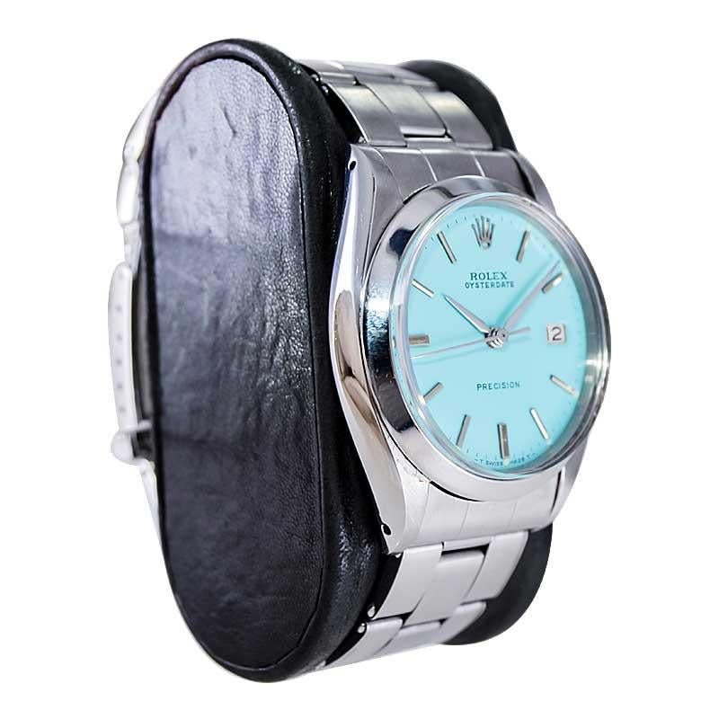 FACTORY / HOUSE: Rolex Watch Company
STYLE / REFERENCE: Oyster Date
METAL / MATERIAL: Stainless Steel
CIRCA / YEAR: 1957
DIMENSIONS / SIZE: Length 41mm X Diameter 35mm
MOVEMENT / CALIBER: Manual Winding / 17 Jewels 
DIAL / HANDS: Custom Finish