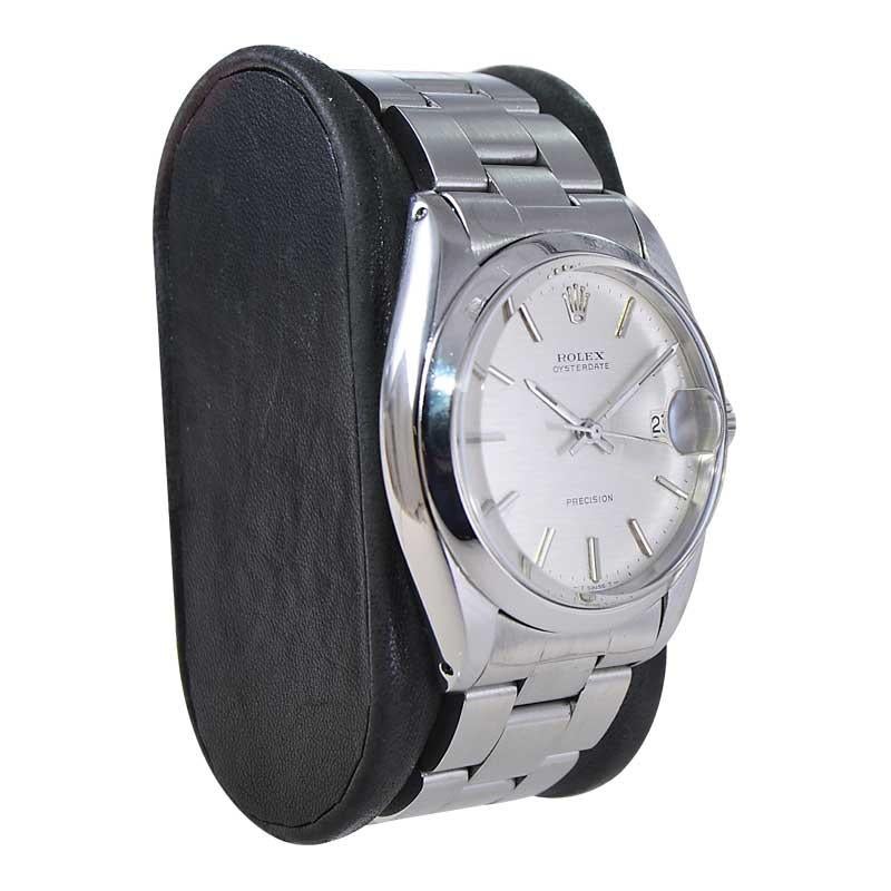 FACTORY / HOUSE: Rolex Watch Company
STYLE / REFERENCE: Oysterdate / Reference 6694
METAL / MATERIAL: Stainless Steel 
CIRCA / YEAR: Mid-1960's
DIMENSIONS / SIZE: Length 42mm X Diameter 35mm
MOVEMENT / CALIBER: Manual Winding / 17 Jewels 
DIAL /