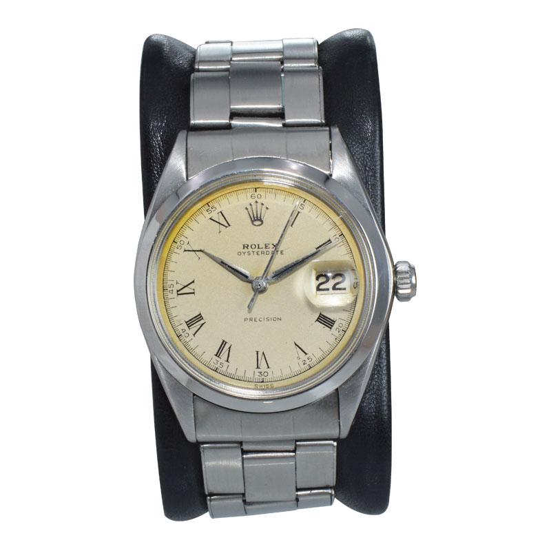 FACTORY / HOUSE: Rolex Watch Company
STYLE / REFERENCE: Oysterdate / Reference 6694
METAL / MATERIAL: Stainless Steel
CIRCA: 1956 / 1957
DIMENSIONS: Length 41mm X Diameter 34mm
MOVEMENT / CALIBER: Automatic Winding / 17 Jewels 
DIAL / HANDS: