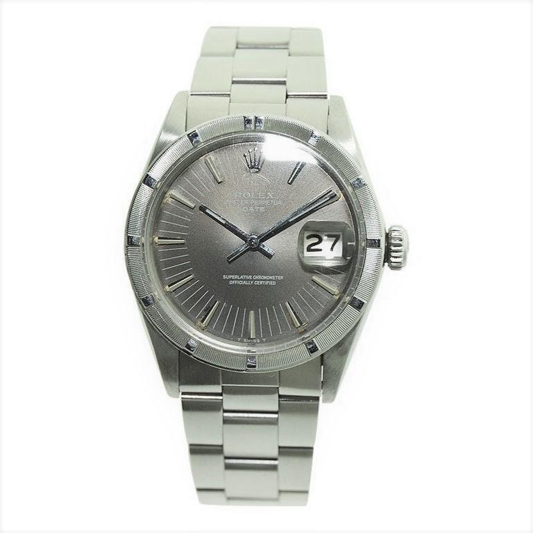FACTORY / HOUSE: Rolex Watch Company
STYLE / REFERENCE: Oyster Perpetual Date / Index Bezel
CIRCA: 1970's
MOVEMENT / CALIBER: 26 jewel / Caliber 1570
DIAL / HANDS: Original, Charcoal
DIMENSIONS: Length 38mm X Diameter 35mm
ATTACHMENT / LENGTH: