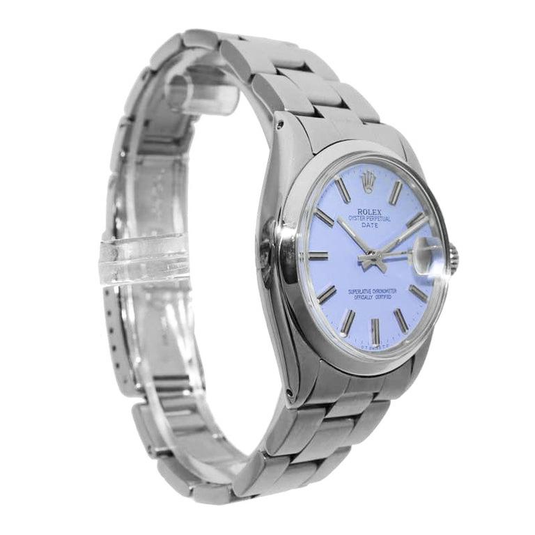 FACTORY / HOUSE: Rolex Watch Company
STYLE / REFERENCE: Oyster Perpetual Date
METAL / MATERIAL: Stainless Steel
CIRCA / YEAR: 1970's
DIMENSIONS / SIZE: Length 39mm X Diameter 34mm
MOVEMENT / CALIBER: Perpetual winding
DIAL / HANDS: Custom Lavender