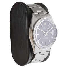 Rolex Steel Oyster Perpetual Date with Rare Black Dial and Engine Turned Bezel