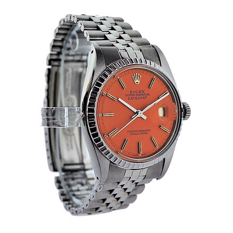 FACTORY / HOUSE: Rolex Watch Company
STYLE / REFERENCE: Datejust / Reference 1601 
METAL / MATERIAL: Stainless Steel
CIRCA: 1970's
DIMENSIONS: 44mm x 36mm
MOVEMENT / CALIBER: Perpetual Winding / 26 Jewels / Caliber 1570
DIAL / HANDS: Custom Orange