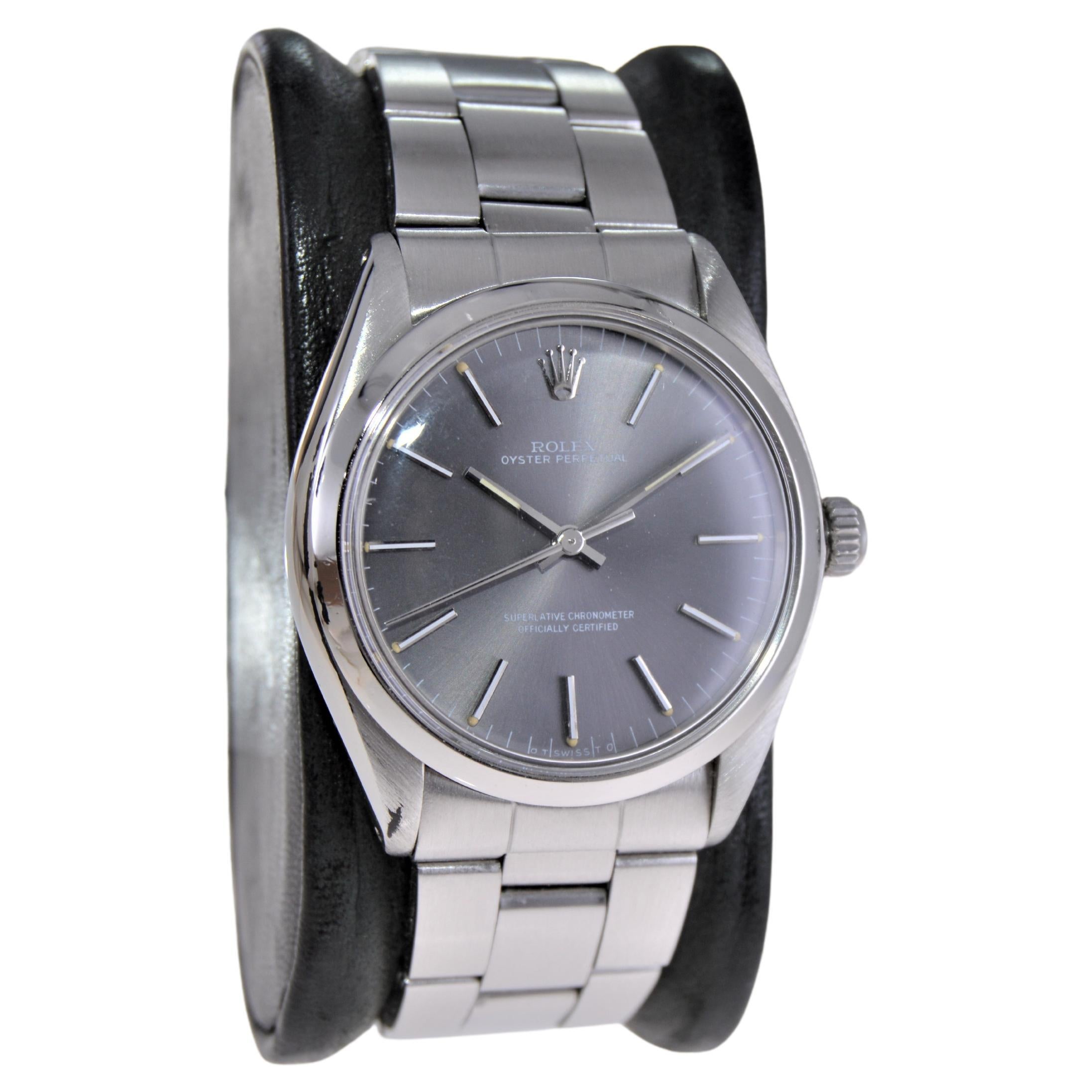 FACTORY / HOUSE: Rolex Watch Company
STYLE / REFERENCE: Round Oyster Perpetual / Reference 1002
METAL / MATERIAL: Stainless Steel 
CIRCA / YEAR: Early 1960's
DIMENSIONS / SIZE: 40mm x 34mm
MOVEMENT / CALIBER: Manual Winding / 26 Jewels 
DIAL /