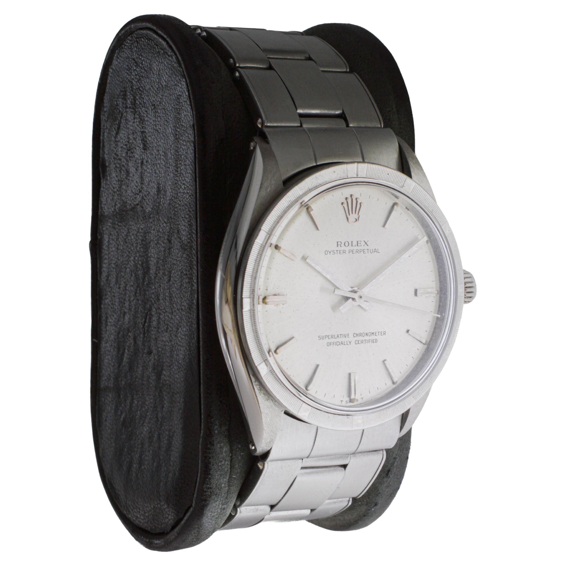 FACTORY / HOUSE: Rolex Watch Company
STYLE / REFERENCE: Oyster Perpetual / Reference 1007
METAL / MATERIAL: Stainless Steel
CIRCA / YEAR: 1960's
DIMENSIONS / SIZE: Length 39mm X Diameter 35mm
MOVEMENT / CALIBER: Perpetual Winding / 26 Jewels /