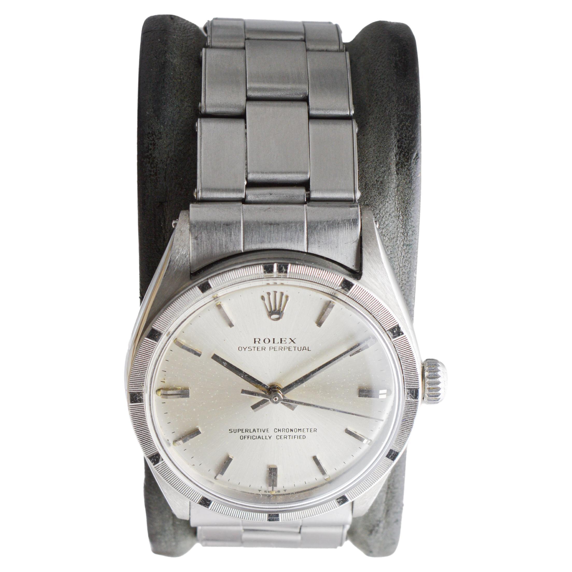 Rolex Steel Oyster Perpetual with Rare Engine Turned Bezel circa, 1960's für Damen oder Herren im Angebot