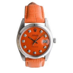 Rolex Steel Oysterdate with Custom Orange Dial and Diamond Markers circa, 1980
s Rolex Steel Oysterdate with Custom Orange Dial and Diamond Markers circa, 1980
s