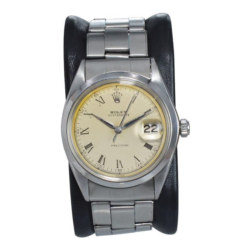 FACTORY / HOUSE: Rolex Watch Company
STYLE / REFERENCE: Oysterdate / Reference 6694
METAL / MATERIAL: Stainless Steel
CIRCA: 1956 / 1969
DIMENSIONS: Length 41mm X Diameter 34mm
MOVEMENT / CALIBER: Automatic Winding / 17 Jewels 
DIAL / HANDS: