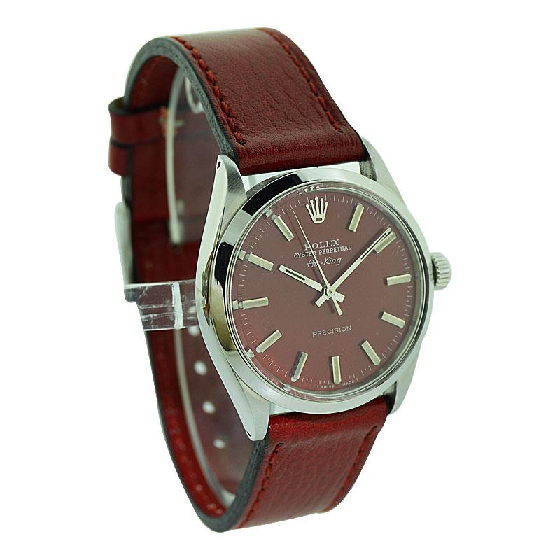 FACTORY / HOUSE: Rolex Watch Company
STYLE / REFERENCE: Air King / Ref. 1002
METAL / MATERIAL: Stainless Steel 
DIMENSIONS / SIZE: 39mm X 34mm
MOVEMENT / CALIBER: Perpetual Winding / 26 Jewels 
DIAL / HANDS: Custom Red Dial with Baton Markers /