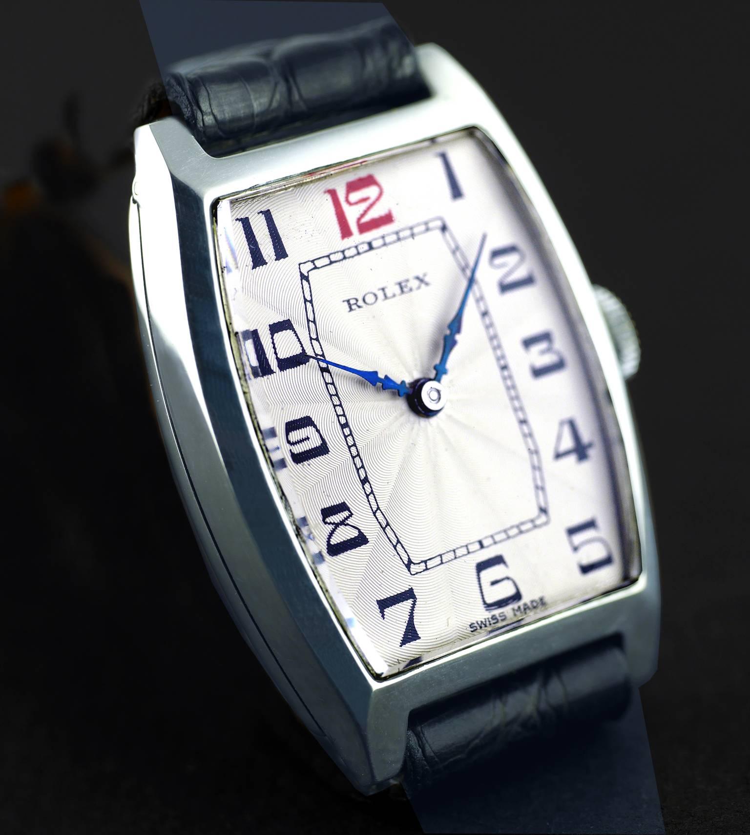 An Art Deco vintage wristwatch by Rolex made in 1926.

The silver tonneau shaped case marked “7 World’s Records” and “Gold Medal, Geneva - Suisse”,  hinged silver case hallmarked for Glasgow Import into the United Kingdom in 1926.

15-Jewel movement