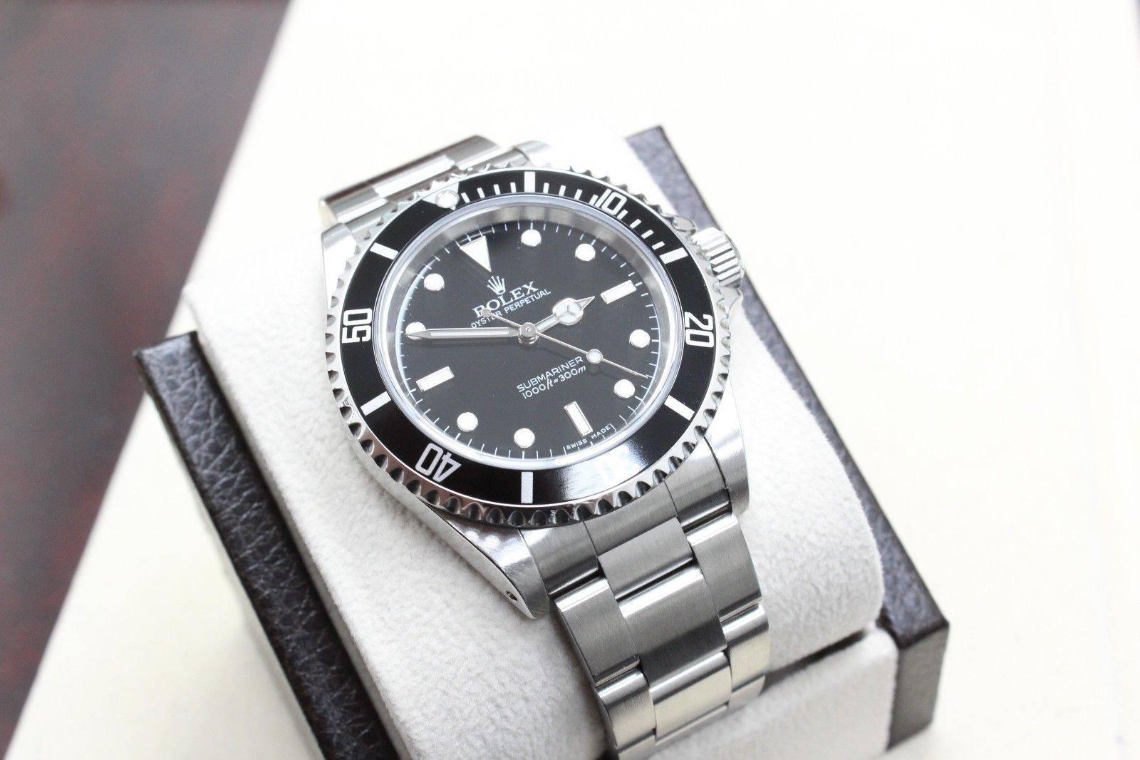 Style Number: 14060
Serial: P343***
Model: Submariner 
Case Material: Stainless Steel
Band: Stainless Steel
Bezel: Black
Dial: Black
Face: Sapphire Crystal 
Case Size: 40mm

Includes: 
-Rolex Box & Papers
-Certified Appraisal 
-6 Month