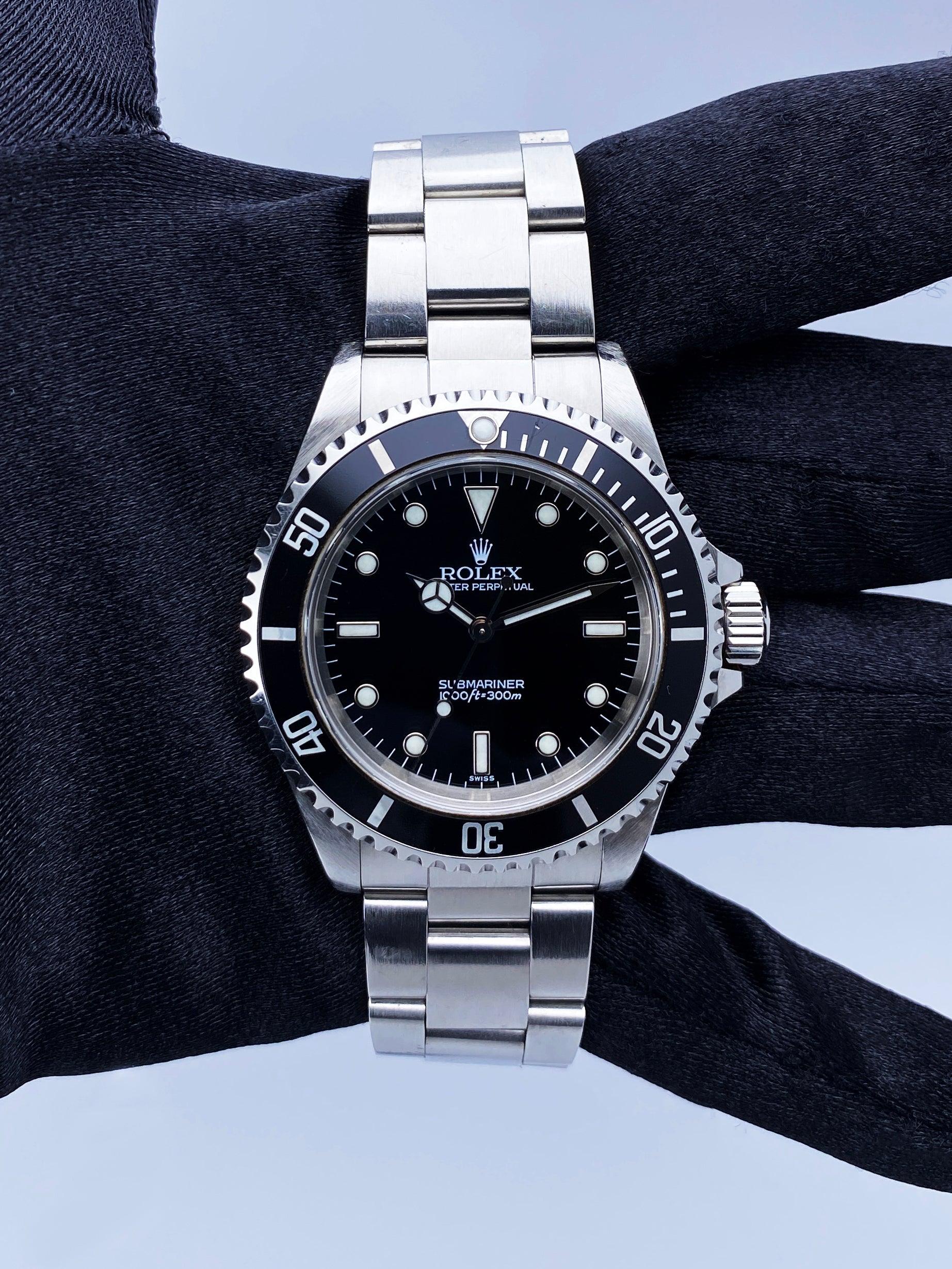 Rolex Oyster Perpetual Submariner No Date 14060 Mens Watch. 40mm stainless steel case. Unidirectional rotating bezel with black bezel insert. Black dial with luminous Mercedes steel hands and index hour marker. Stainless steel Oyster bracelet with a
