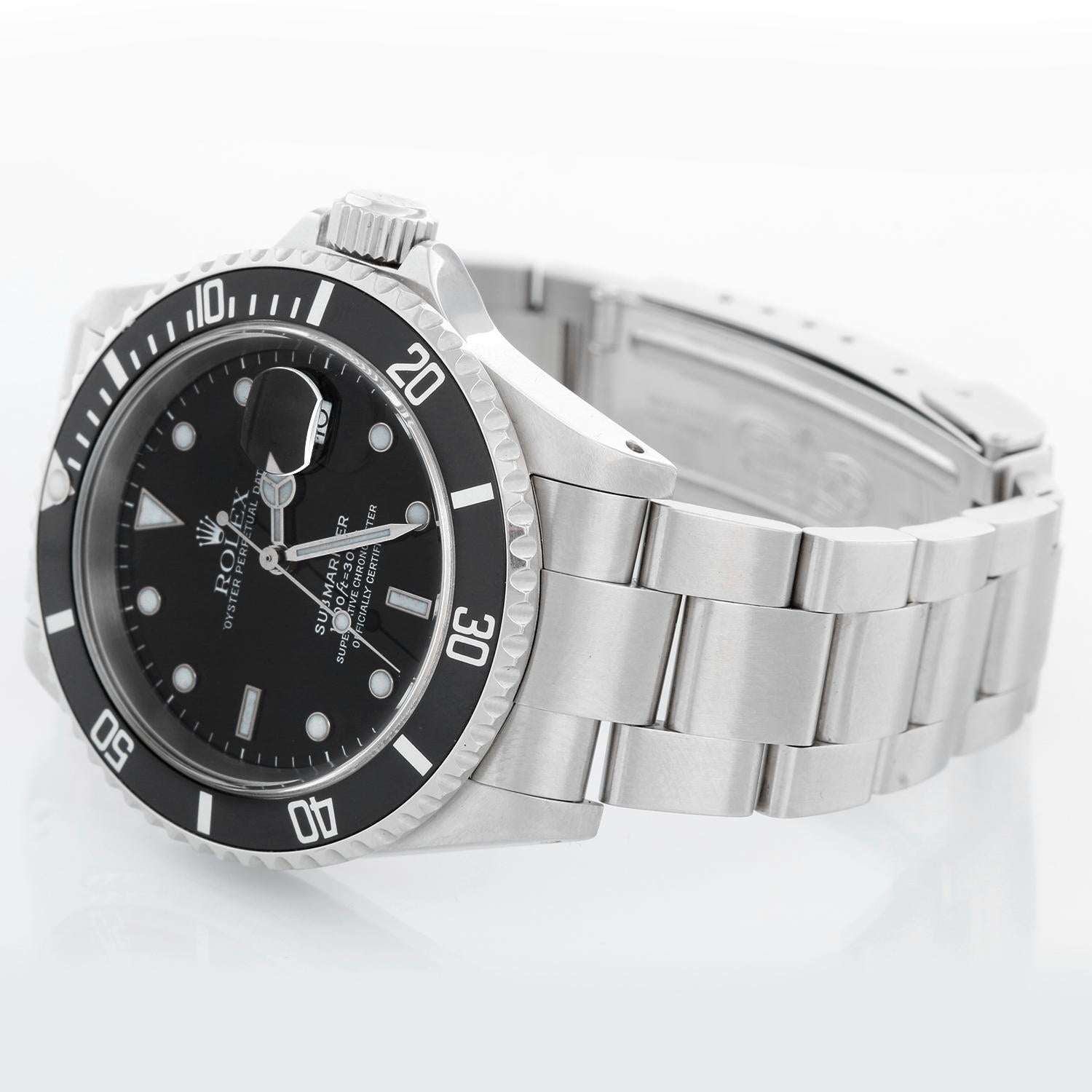 Rolex Submariner 16610 Stainless Steel Men's Watch - Automatic winding, 31 jewels, Quickset, sapphire crystal. Stainless steel case; rotating bezel with black insert. Black Dial. Stainless steel Oyster bracelet with flip-lock clasp. Pre-owned with