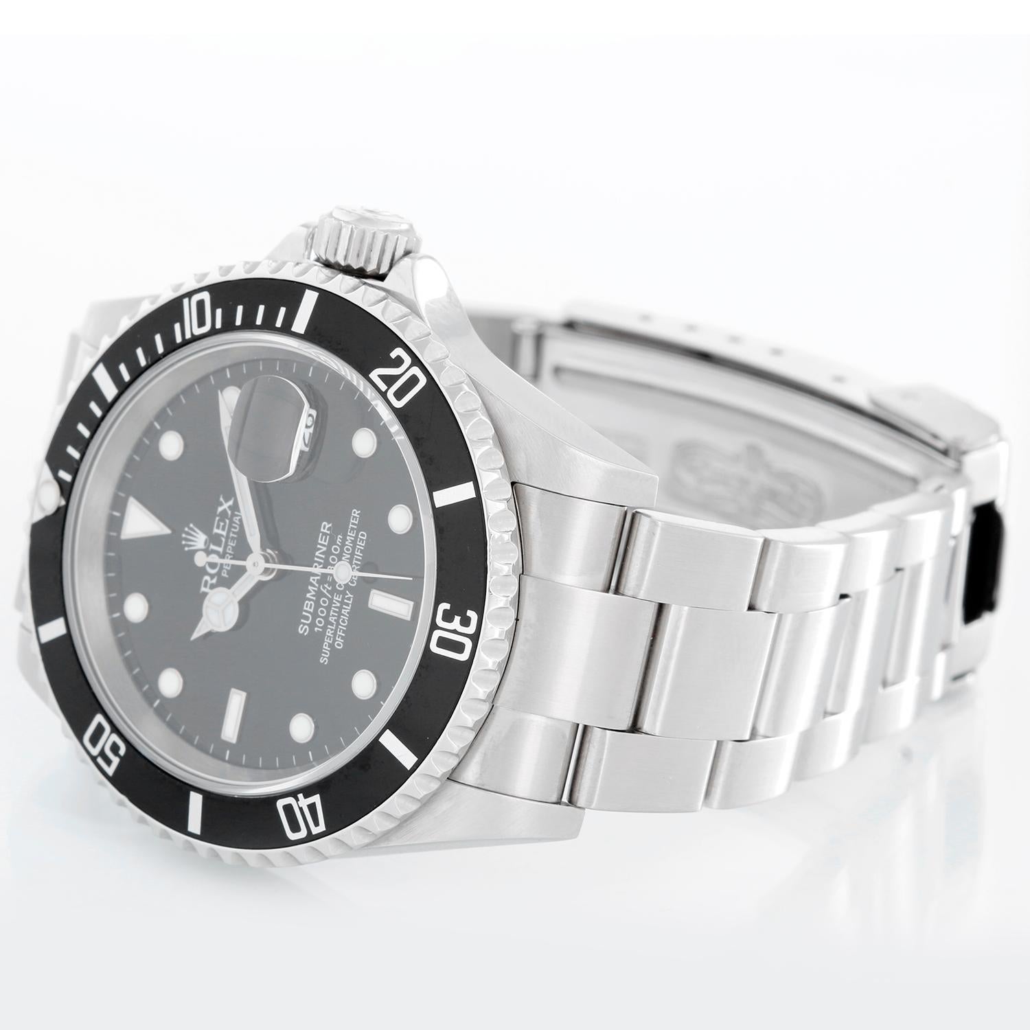 Rolex Submariner 16610 Stainless Steel Men's Watch - Automatic winding, 31 jewels, Quickset, sapphire crystal. Stainless steel case; rotating bezel with black insert. Black Dial. Stainless steel Oyster bracelet with flip-lock clasp. Pre-owned with