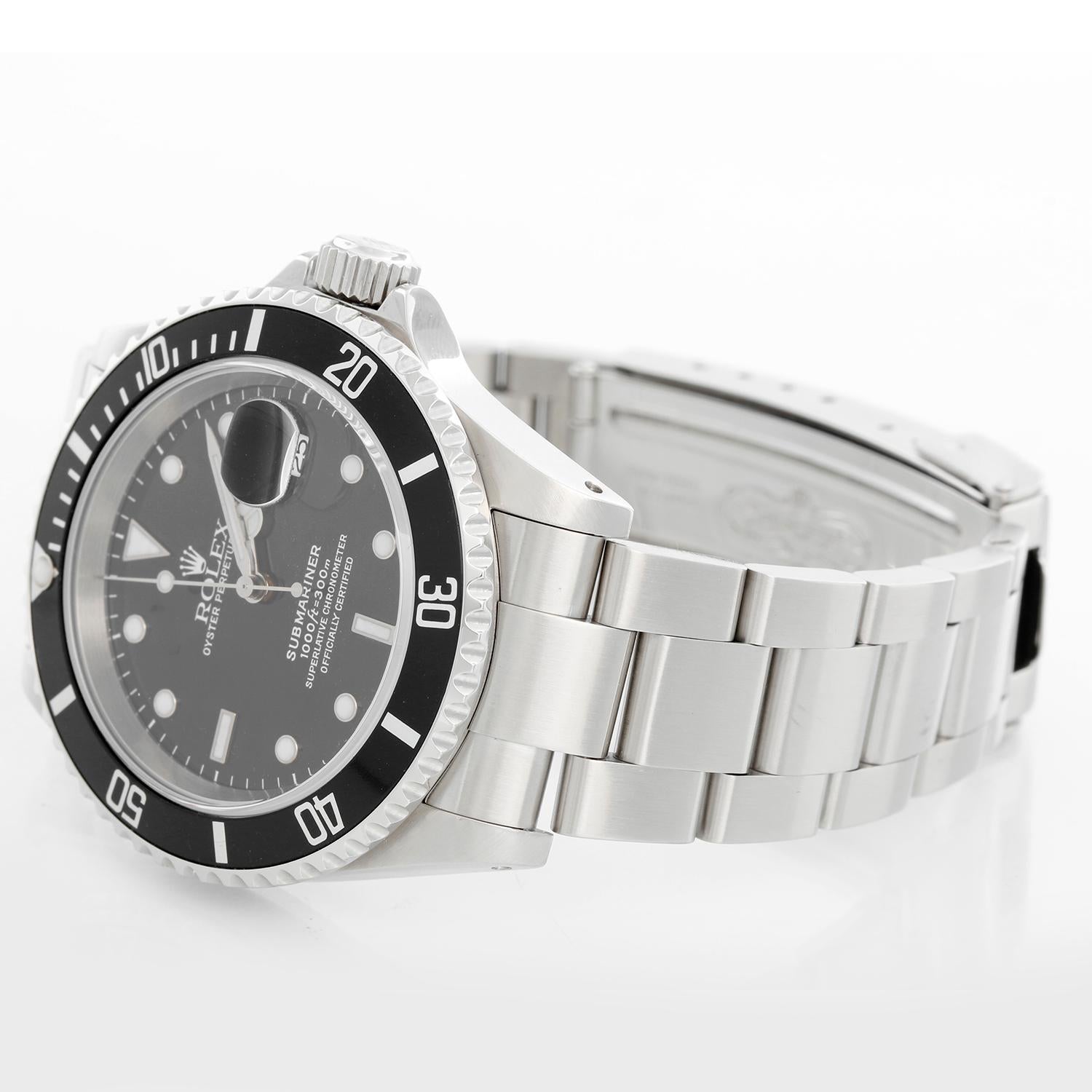 Rolex Submariner 16610 Stainless Steel Men's Watch - Automatic winding, 31 jewels, Quickset, sapphire crystal. Stainless steel case; rotating bezel with black insert. Black Dial. Stainless steel Oyster bracelet with flip-lock clasp. Pre-owned with